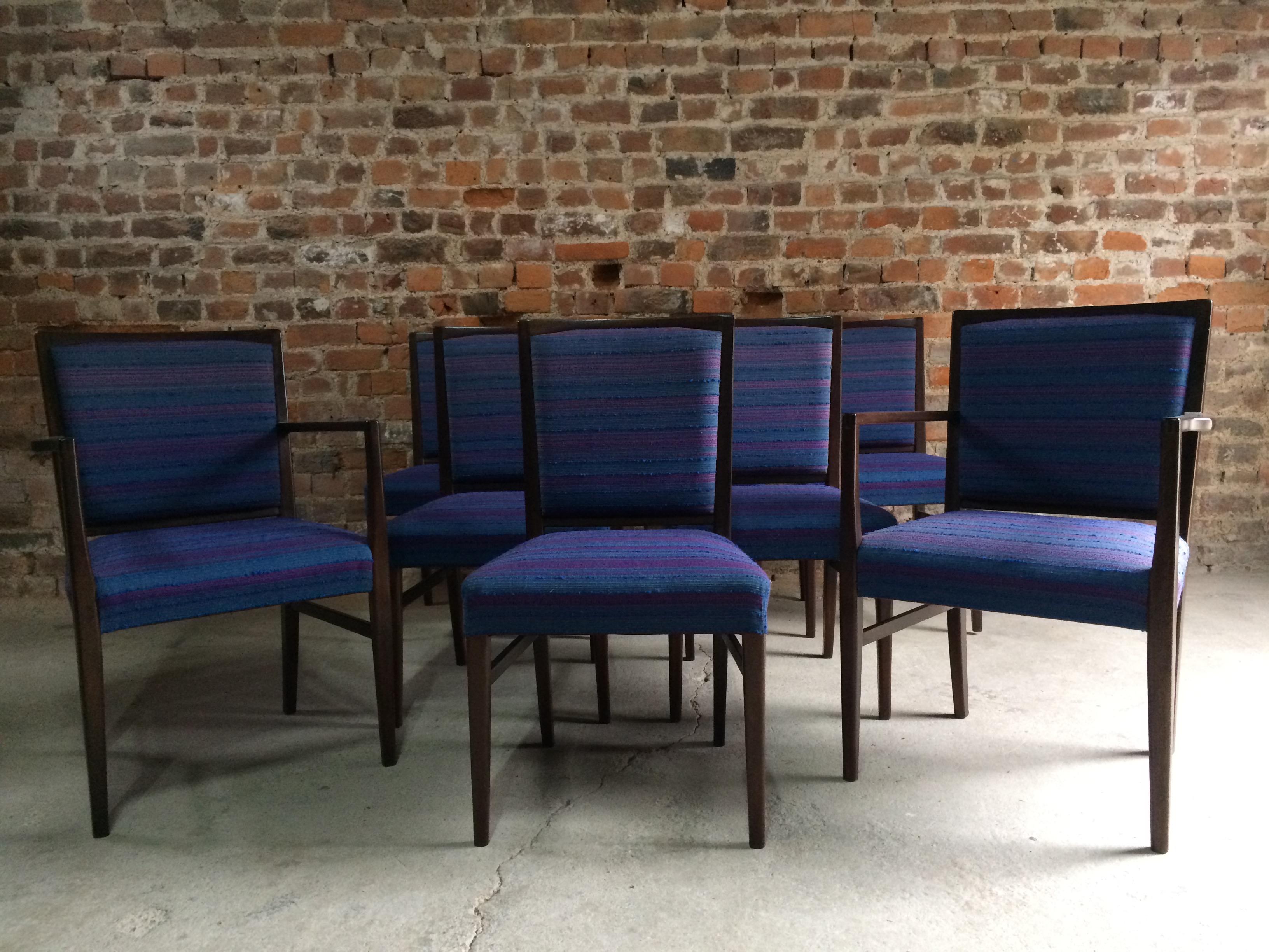 Magnificent set of eight midcentury Gordon Russell 'Marwood’ Santos rosewood dining chairs circa 1970, set of 6 diners and 2 carvers beautifully constructed from solid Brazilian Santos rosewood, upholstered in original wool blue