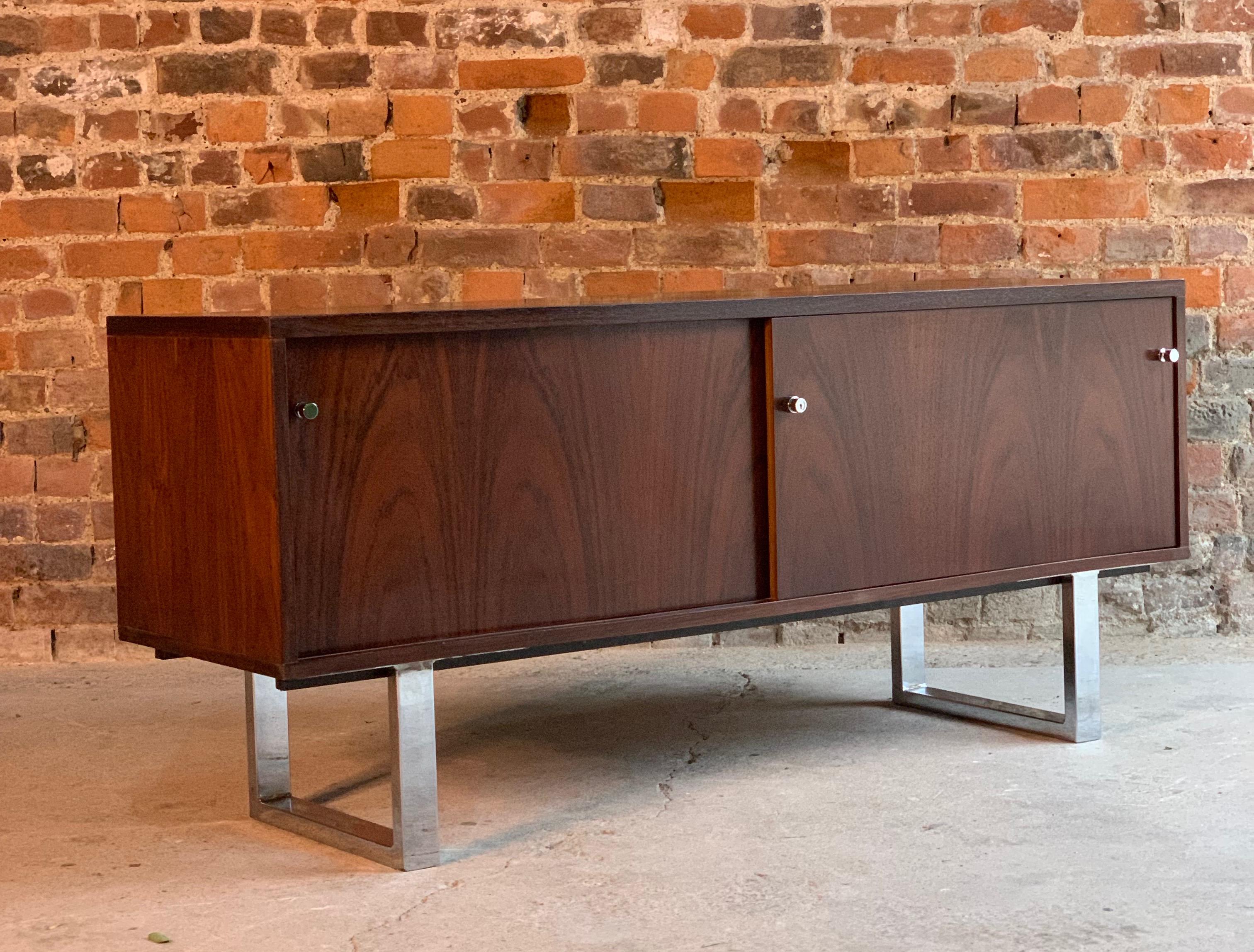 Gordon Russell rosewood sideboard credenza by Trevor China, chrome sled legs, circa 1970

Midcentury rosewood credenza sideboard by Trevor Chinn for Gordon Russell circa 1970, constructed from rosewood and raised on chrome sleigh legs, the