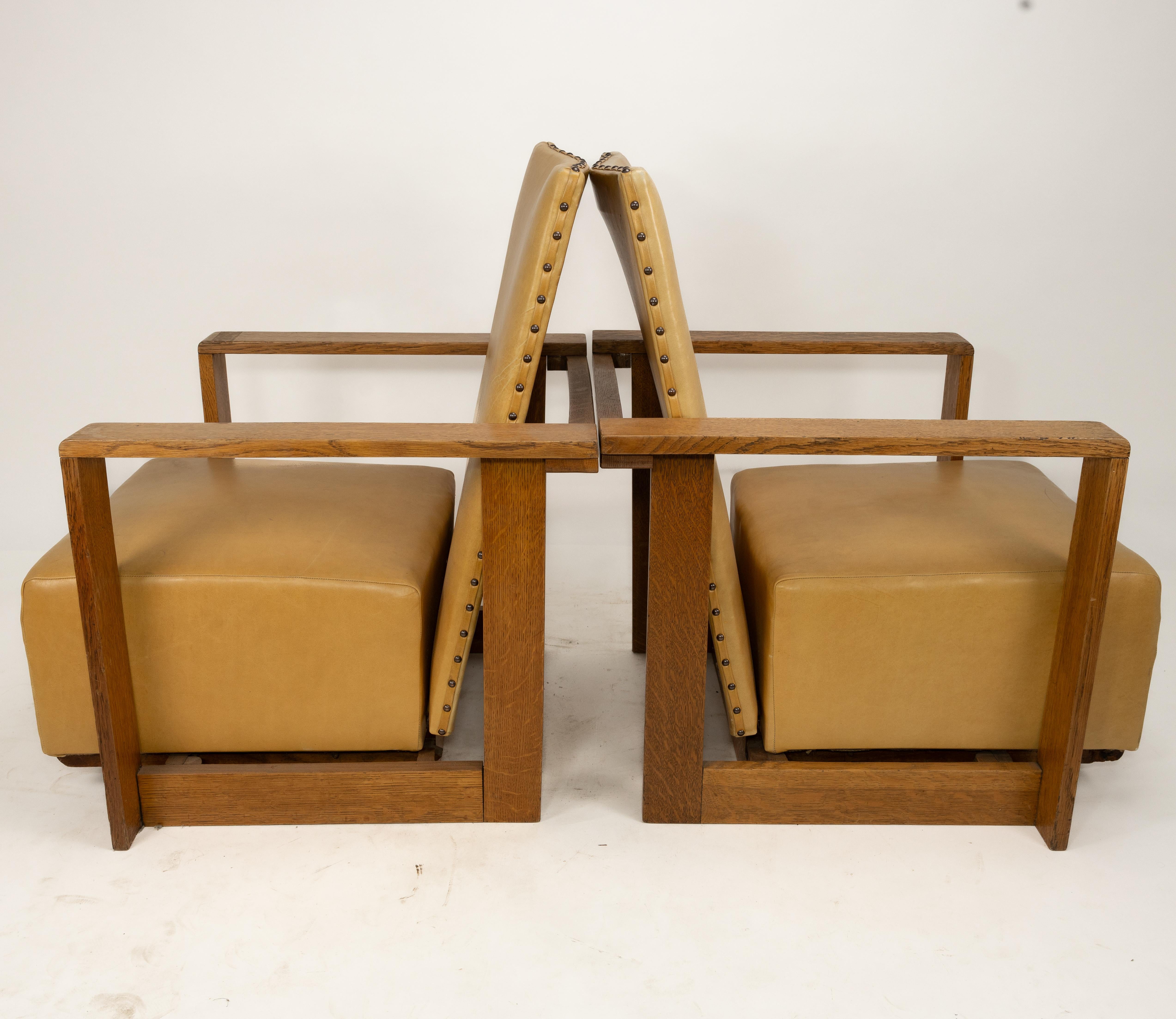 W. H. (Curly) Russell (1906-1971) for Gordon Russell, three oak reclining armchairs, designed in 1930, all professionally re-upholstered in fawn leather. The reclining mechanism works on two rails which allow the seat to move forward and the back to