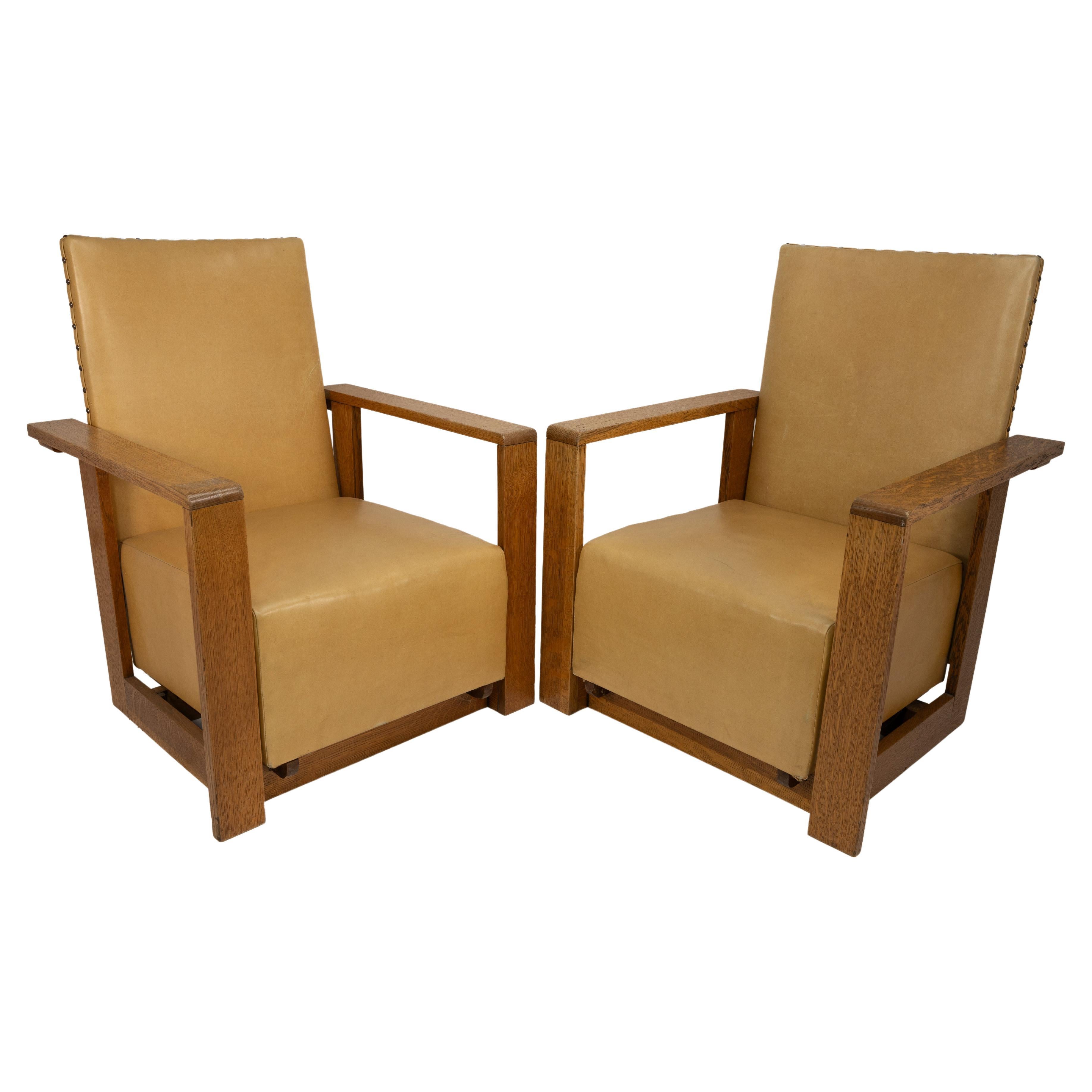 Gordon Russell, W. H. Russell. A pair of Arts & Crafts oak reclining armchairs For Sale