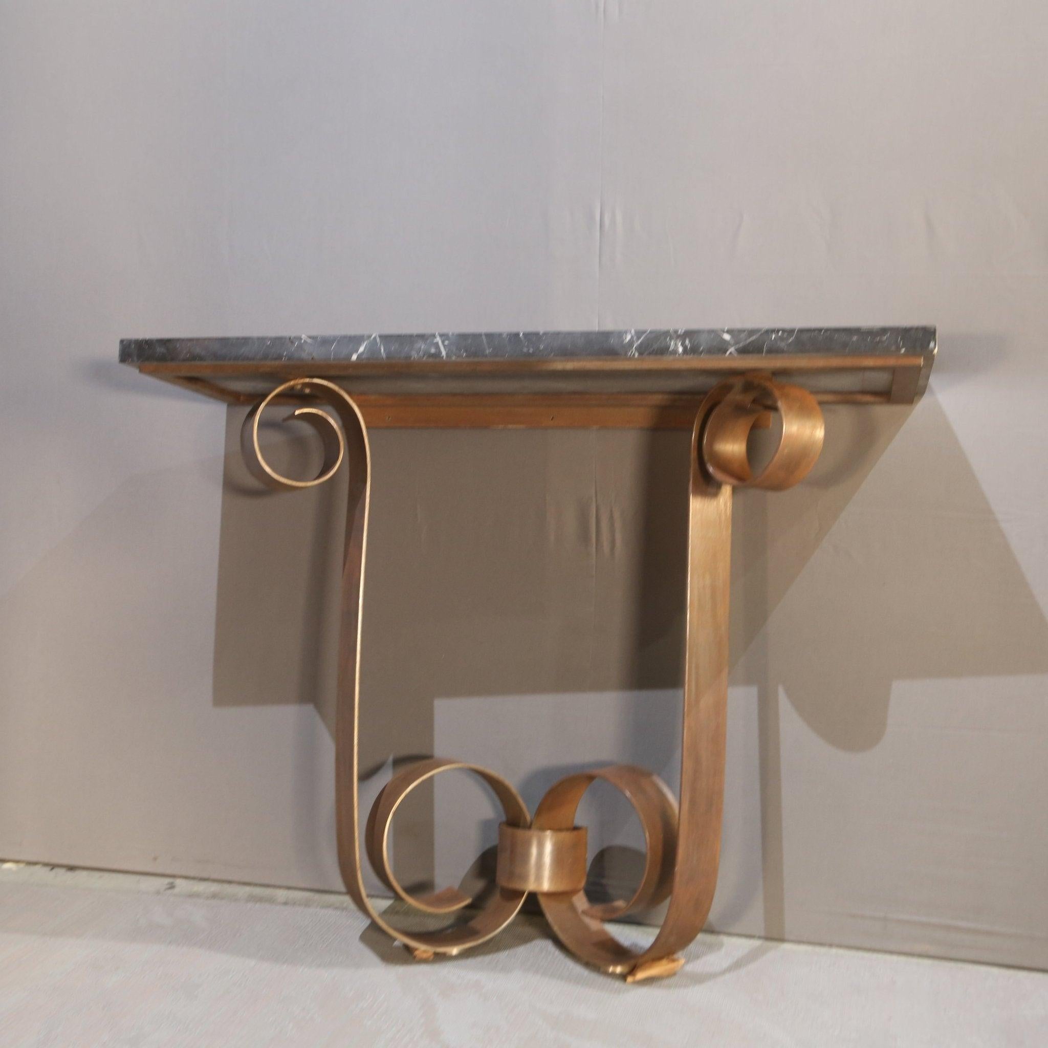 The Wrought Iron & Marble Console by Paul Belvoir for Gordon Watson is a striking piece of furniture. Its combination of sturdy wrought iron and elegant marble creates a sophisticated and timeless look, perfect for any entryway or living room.