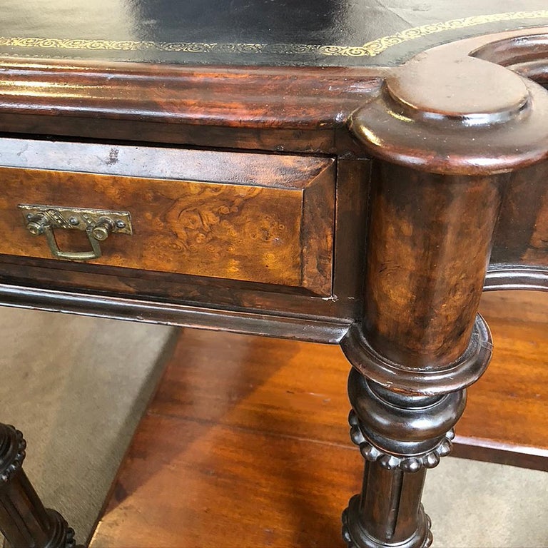 This six drawer, two sided Victorian writing desk is walnut with a dark green leather top and brass pulls. This desk belonged to American writer and public intellectual, Gore Vidal (1925-2012). This 120 plus year old desk is clean ad ready for use.