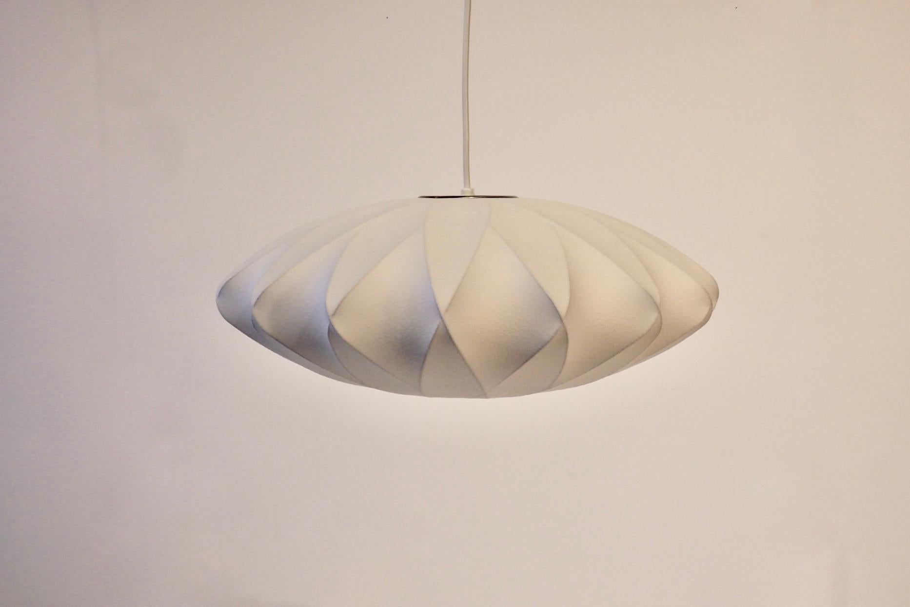 George Nelson criss cross flying saucer hanging bubble lamp. Distributed by Herman Miller.