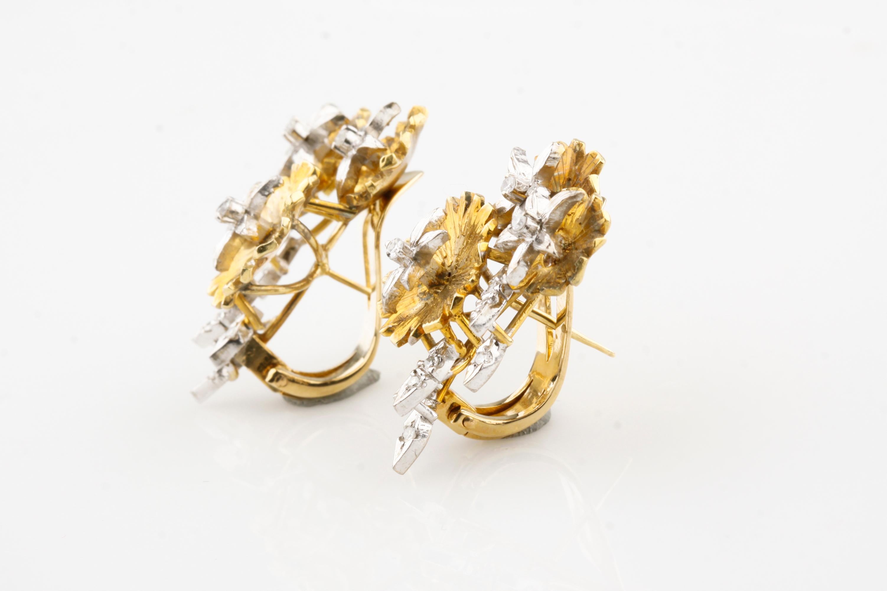 Gorgeous Flower Drop Earrings
Feature three yellow gold blossoms with white gold diamond-studded stamens and leaves
Total Diamond Weight = Appx 0.30 Cts
Total Length of Earrings = 28 mm
Width of Earrings = 20 mm
Total Mass = 16.6 grams
Gorgeous Gift!
