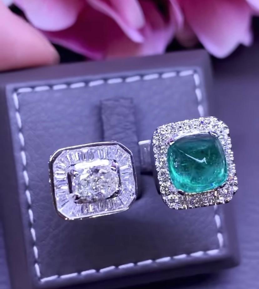 An exquisite and contemporary design for this stunning ring in 18k gold with a Zambia emeralds cabochon cut of 5,31 carats and a GIA centre diamond, oval cut , of 1 ct ,color K and clarity VS2, and around round brilliant cut diamonds of 3,92 carats