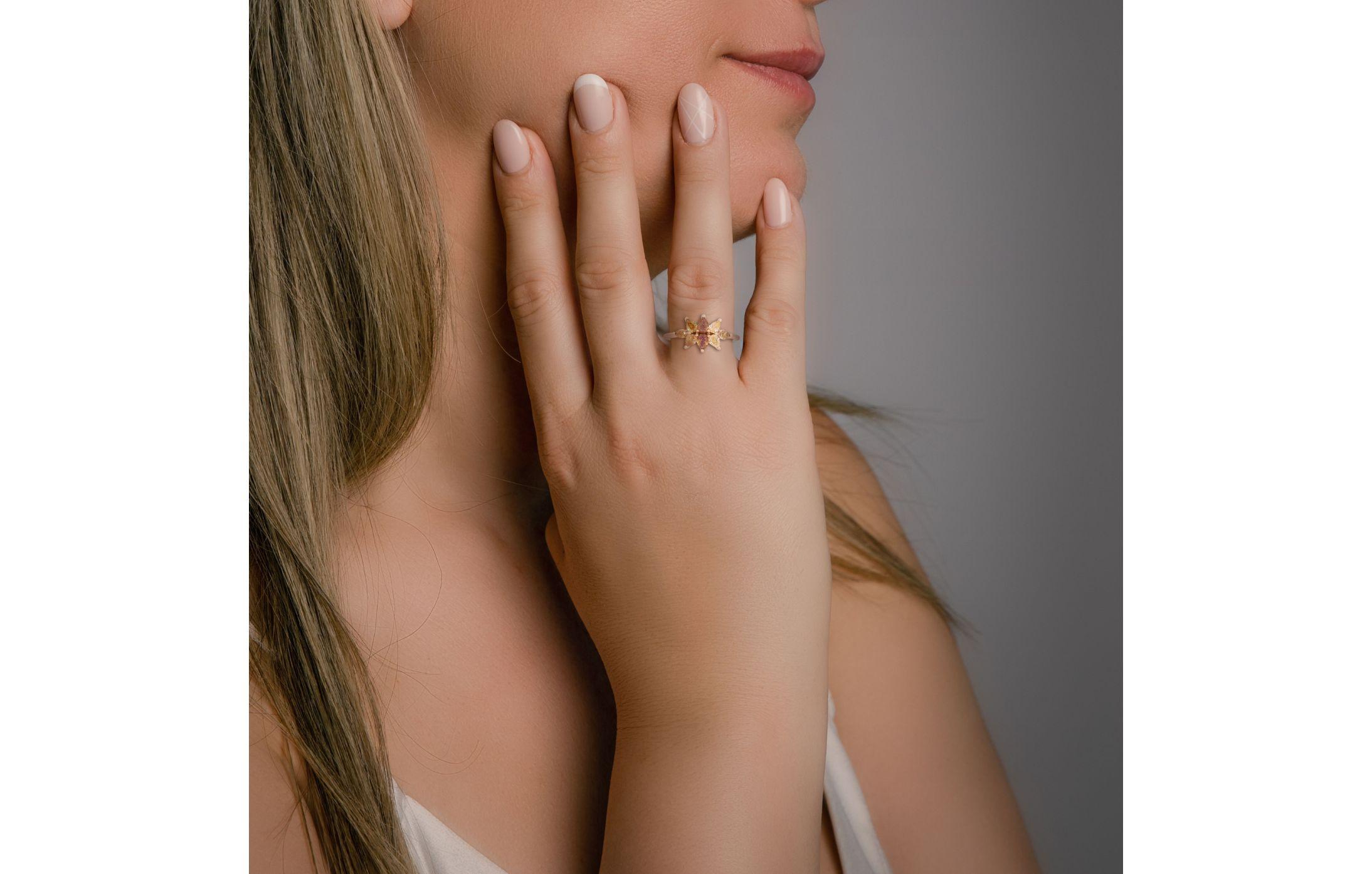 Crafted in lustrous 14K rose gold, the warm and romantic tones of the metal provide the perfect canvas for the floral design. The rose gold complements the diamond beautifully, infusing the ring with a sense of femininity and modern sophistication.