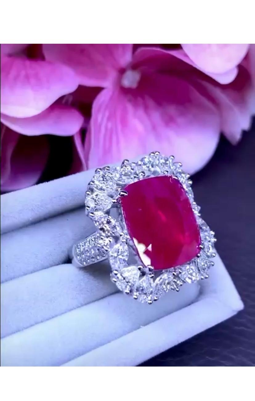 An exclusive design for this ring, handmade , so refined and chic , a piece of contemporary art , in 18k gold with a fabulous cushion cut Burma ruby of 6,93 carats, extra fine quality, transparent, excellent grade , and round brilliant cut diamonds