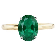 Magnifique bague à deux tons en émeraude naturelle de 1,25 carat avec halo caché