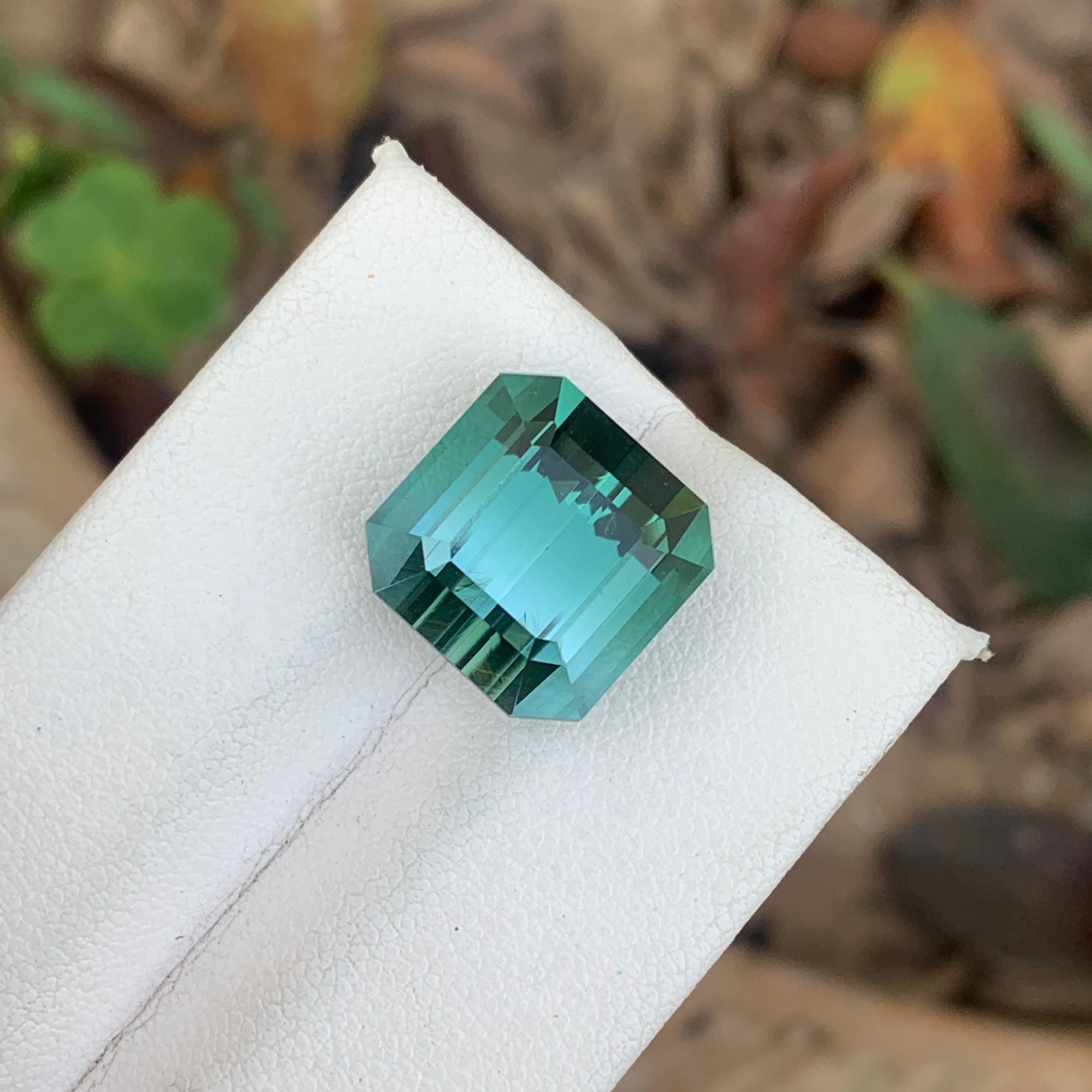 Gorgeous 12.80 Carat Natural Loose Neon Blue Tourmaline Emerald Cut Afghan Mine In New Condition In Peshawar, PK