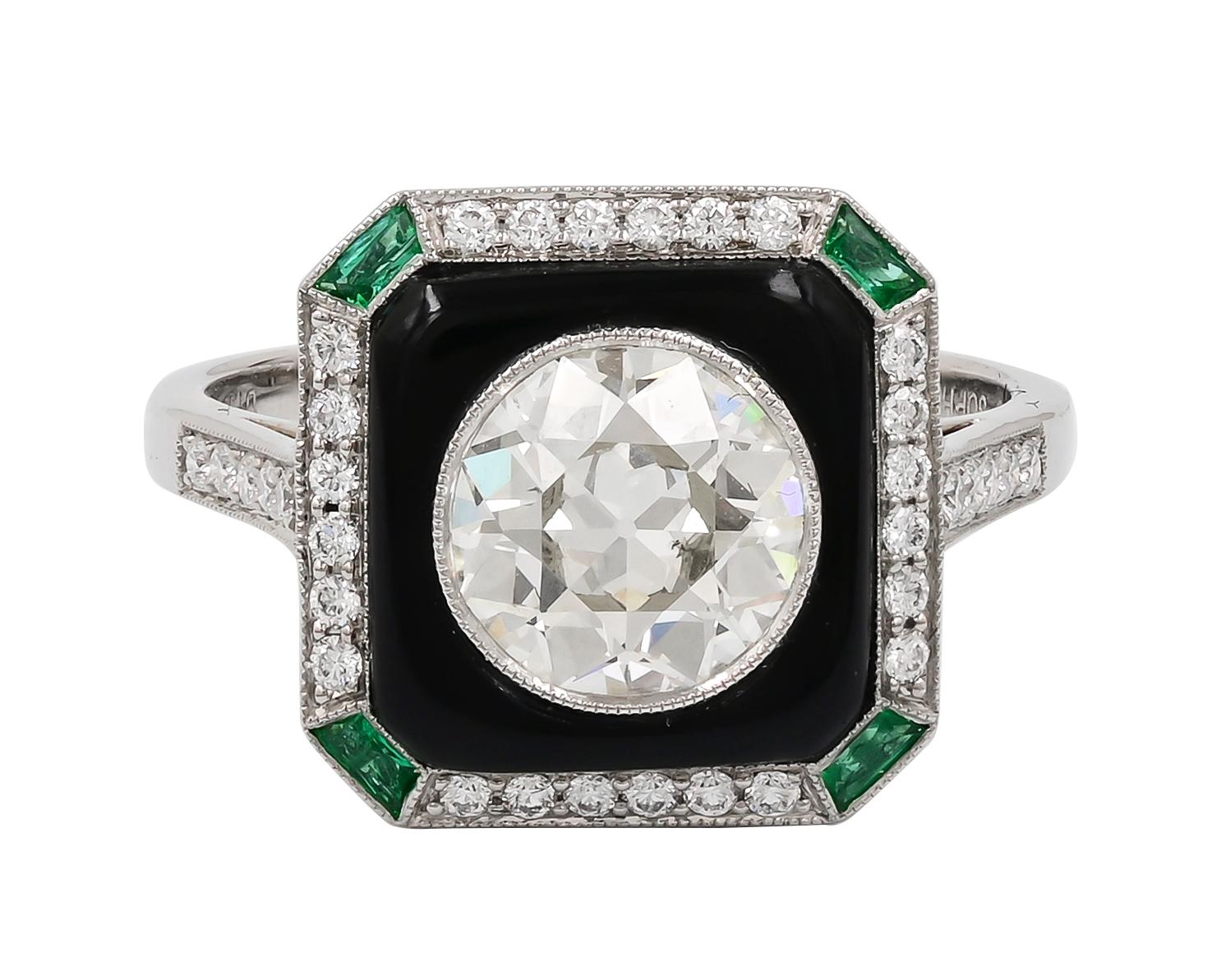 Art Deco platinum ring by Sophia D. The ring features a 1.38 carats round center diamond accented with 4 emeralds that weigh approximately 0.70 carats, 1.38 carats onyx and 0.20 carats diamonds. Ring size is a 6 and available for resizing. 



