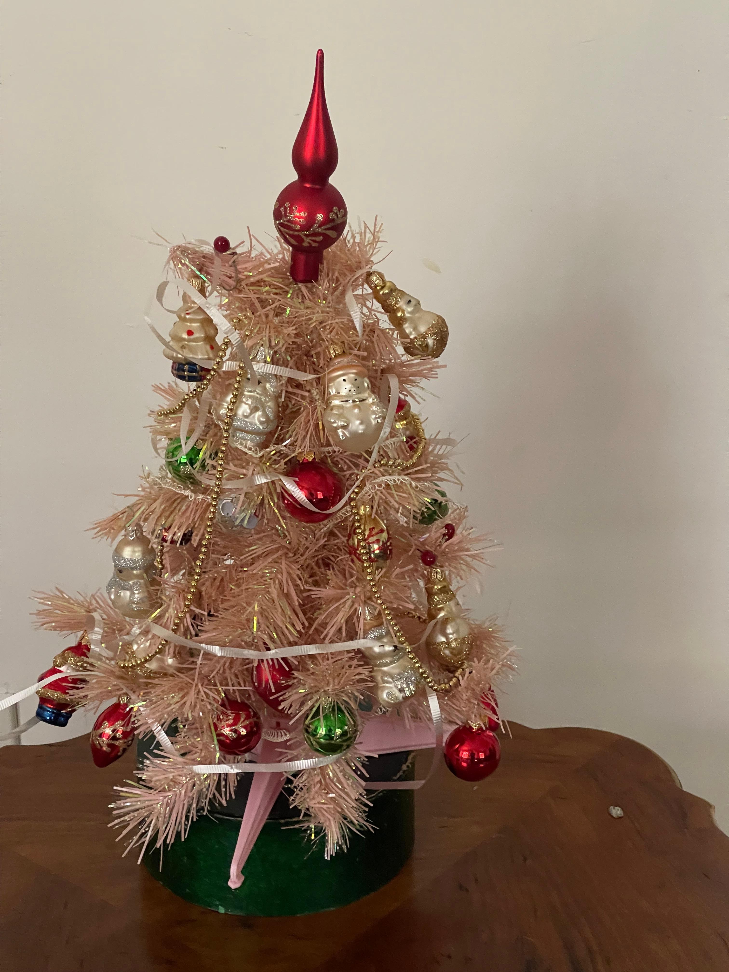Gorgeous vintage small table top 14” pink Christmas tree with miniature glass European Christmas ornaments.