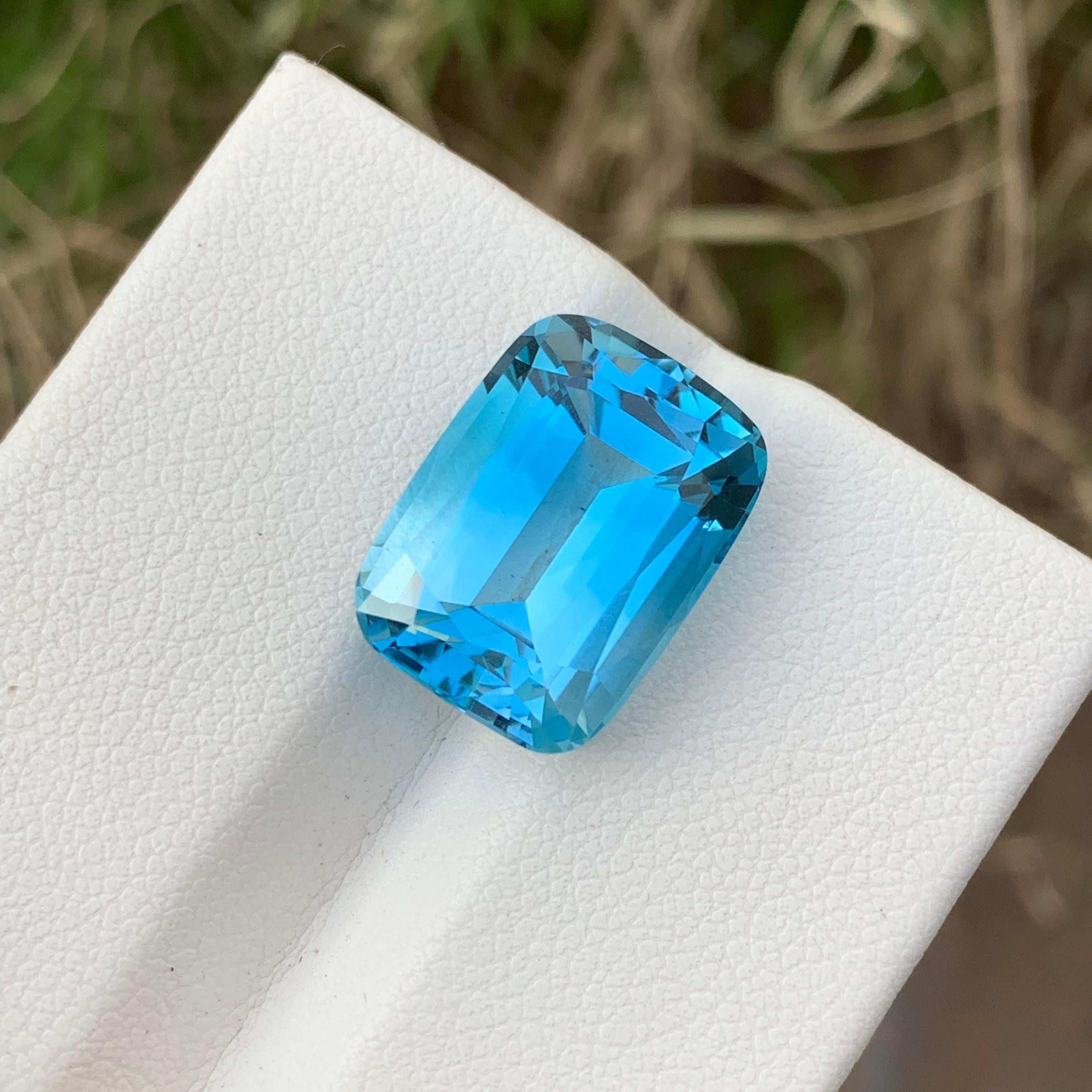 Faceted Blue Topaz
Weight: 14.95 Carats 
Dimension: 16.1x12x8.5 Mm
Origin; Brazil 
Color: Blue
Shape: Long Cushion 
Certificate: On Customer Demand 
.
Blue topaz is a stunning gemstone with various potential benefits. Here are some of its notable