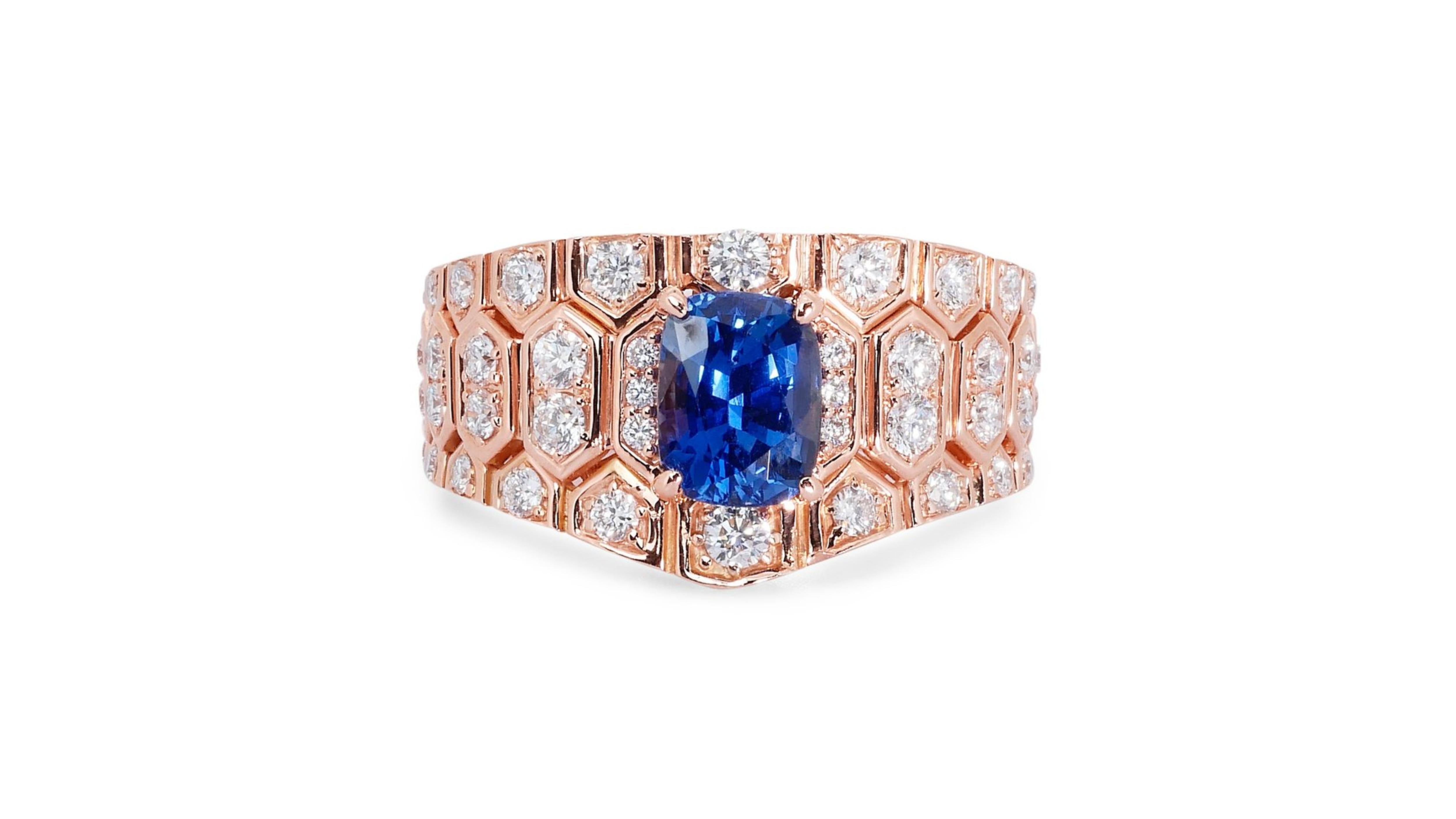 A glamorous dome ring with a dazzling 2.15-carat cushion mixed cut natural sapphire. It has 0.5 carats of side diamonds which add more to its elegance. The jewelry is made of 14K Pink Gold with a high-quality polish. It comes with IGI certificate