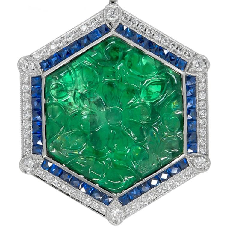 This hexagon design pendant has been crafted with emerald gem stones with the total carat weight of 16.62, surrounded with sapphire stones with the total carat weight of 0.16 and stunning diamonds with the carat weight of 1.38. 


                  