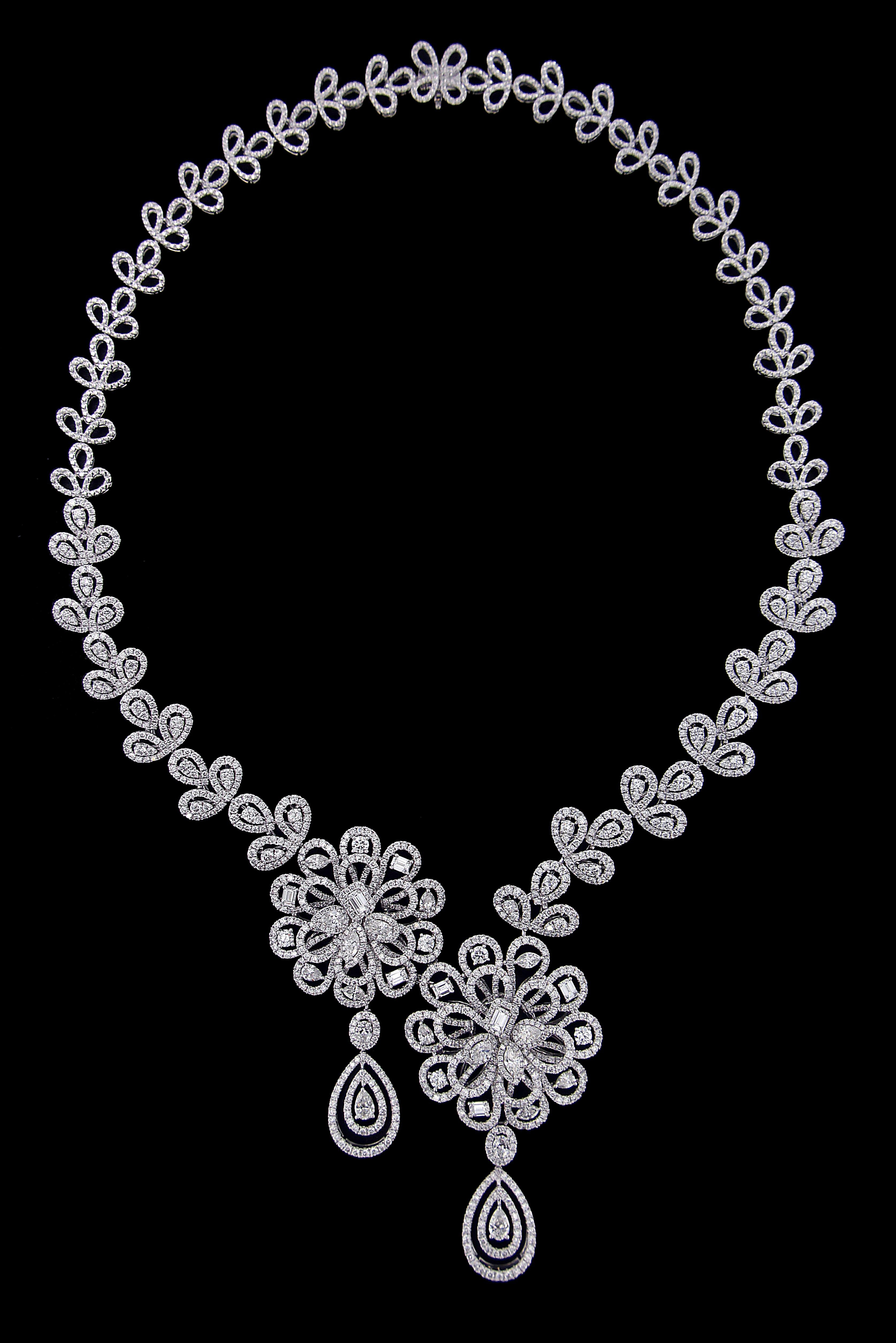 Gorgeous 18 Karat Gold And Diamonds Theme Party Set.
Necklace:
Diamonds of approximately 16.101 carats, mounted on 18 karat white gold necklace. The Necklace weighs approximately around 61.8 grams.

Please note: The charges specified do not include