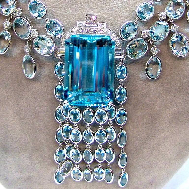 Elegant 18 Karat white gold necklace with aquamarine with a total carat weight of 104.34 together with center aquamarine with the total carat weight of 48.40 surrounded with dazzling diamonds with the total carat weight of 5.27. 

Sophia D by Joseph