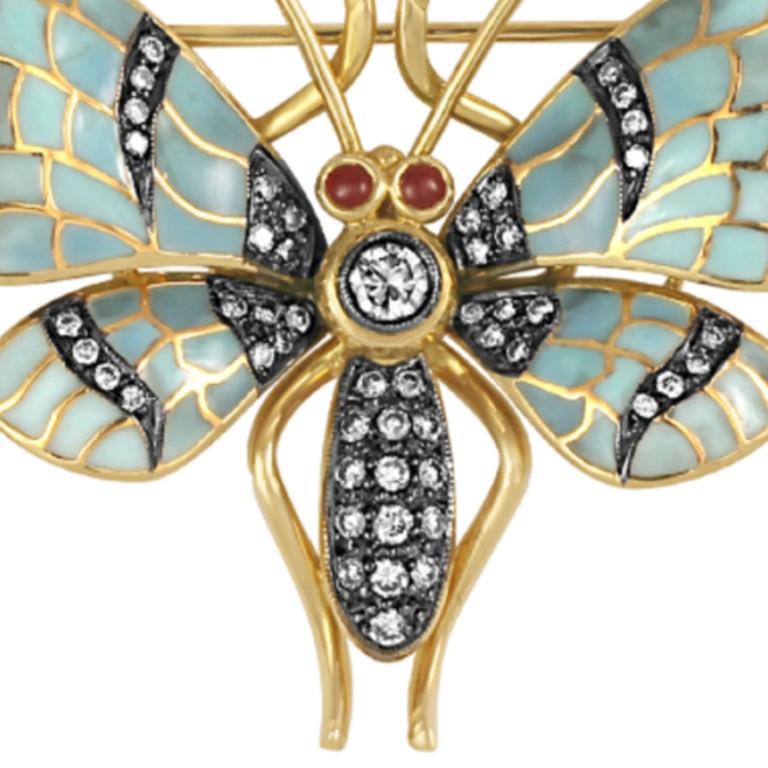 18 karat gold enamel butterfly brooch with 2, 0.11 carat rubies and diamonds (total carat weight 0.67).
                   