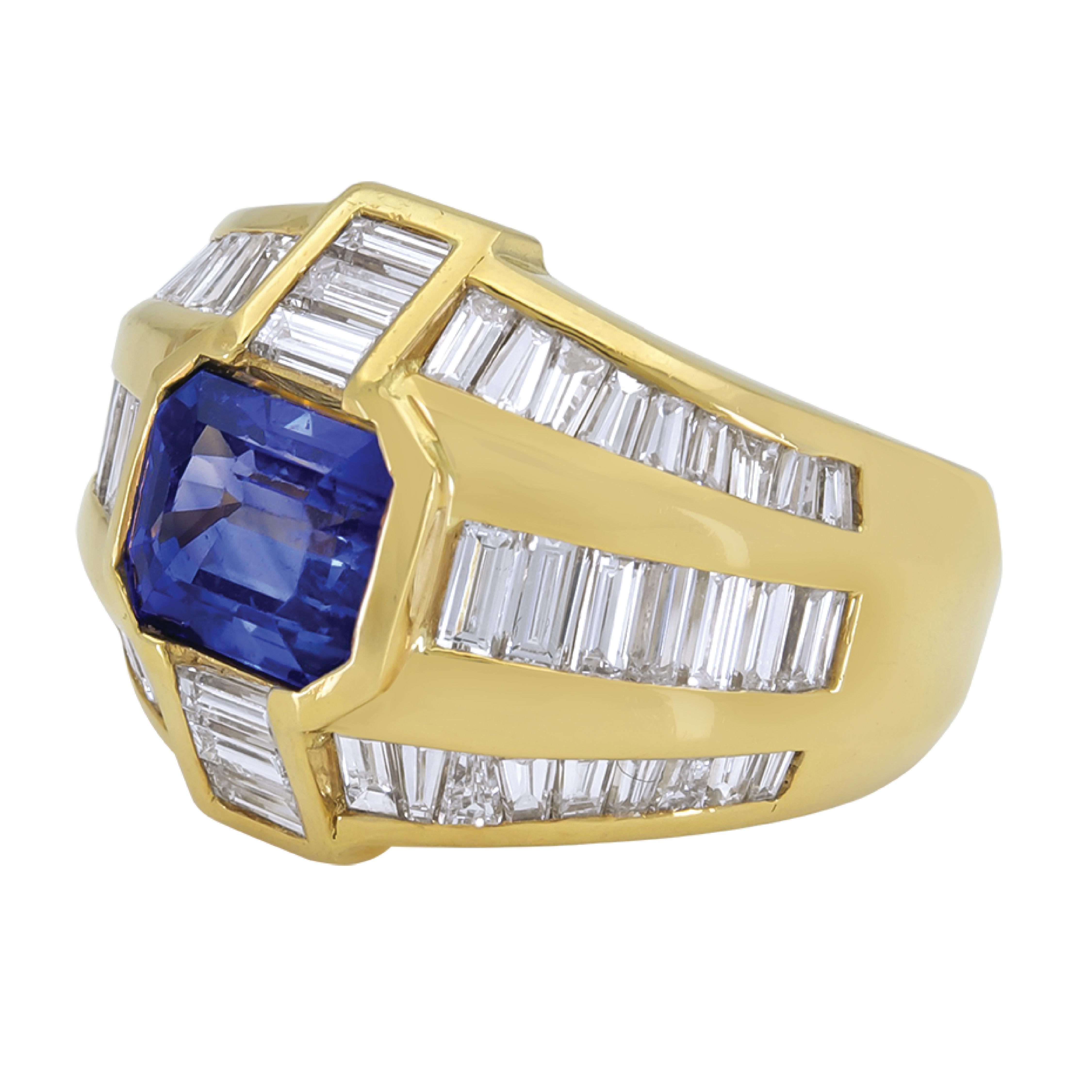 Created and made by Sophia D, this 18 Karat Yellow Gold Center features a blue sapphire weighing 3.04 total carats and accentuated with 2.76 carats weight of baguettes diamonds. 

Sophia D by Joseph Dardashti LTD has been known worldwide for 35