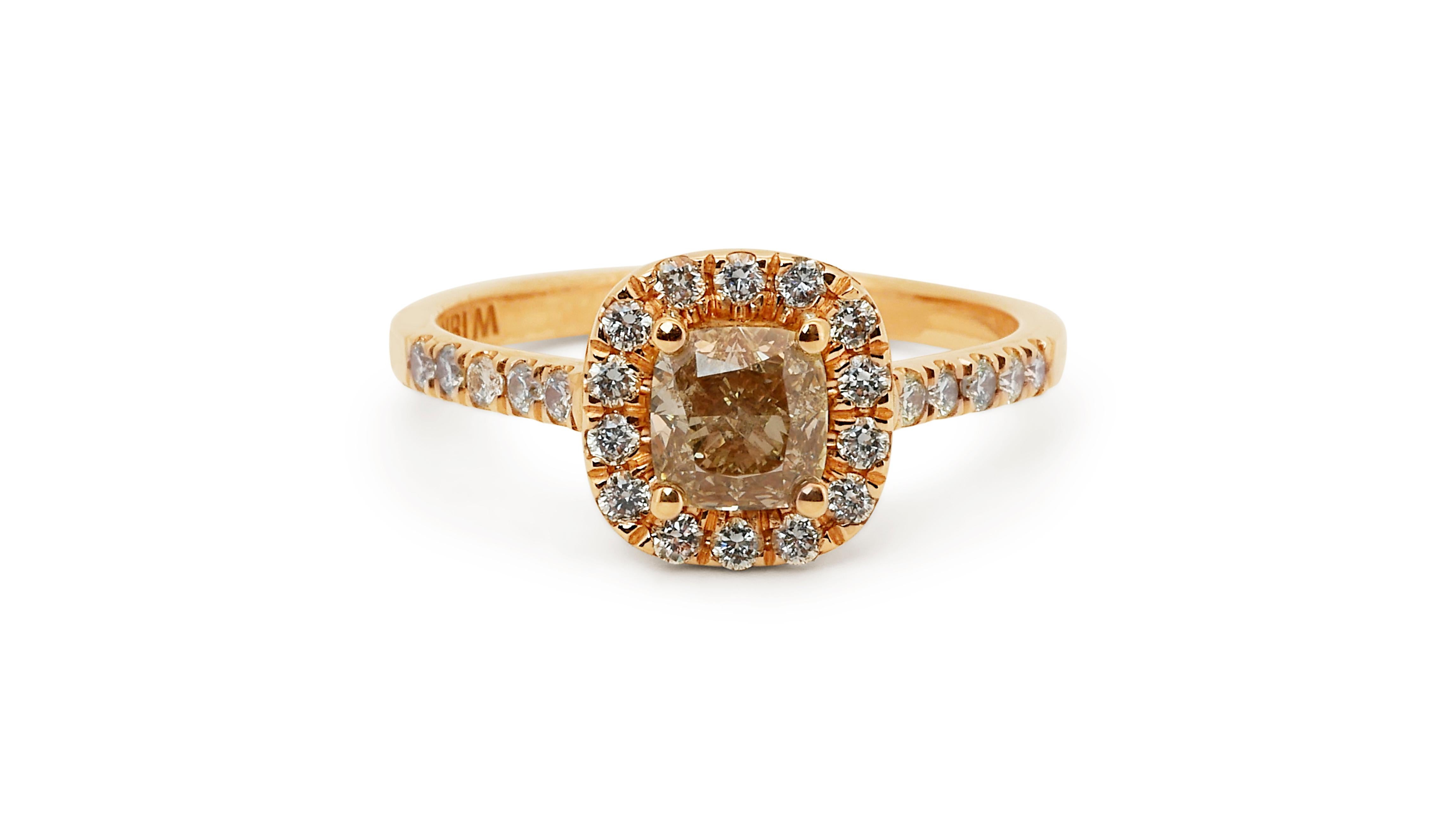 A beautiful cluster halo ring with a dazzling 0.83 carat cushion natural diamond. It has 0.33 carat of side diamonds which add more to its elegance. The jewelry is made of 18K Rose Gold with a high quality polish. It comes with AIG certificate and a