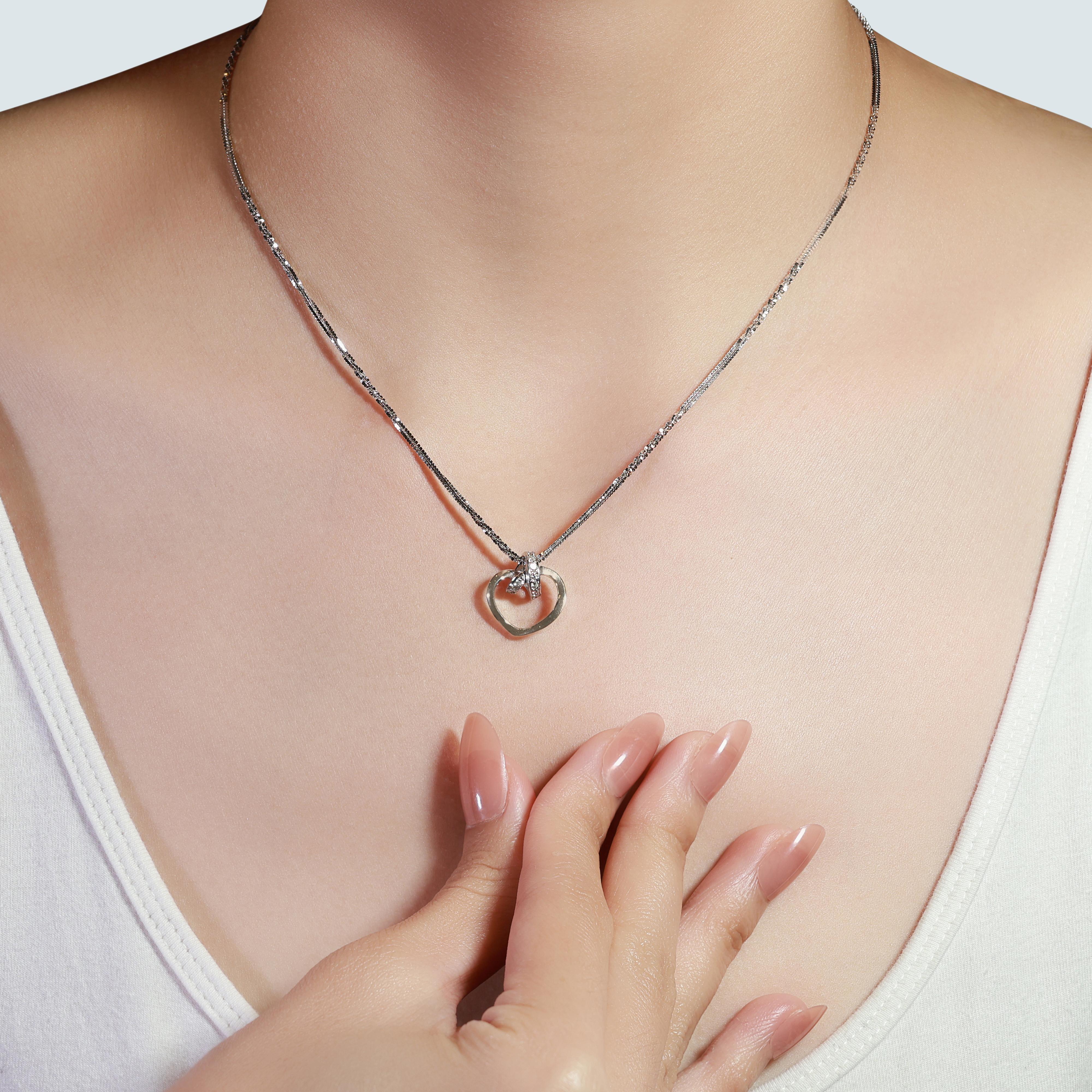 Indulge in timeless elegance with this exquisite piece, crafted from 18K white gold. Adorned with 10 natural round brilliant diamonds with a total carat weight of 0.2ct, each diamond shines with a J color grade and VS clarity. This stunning