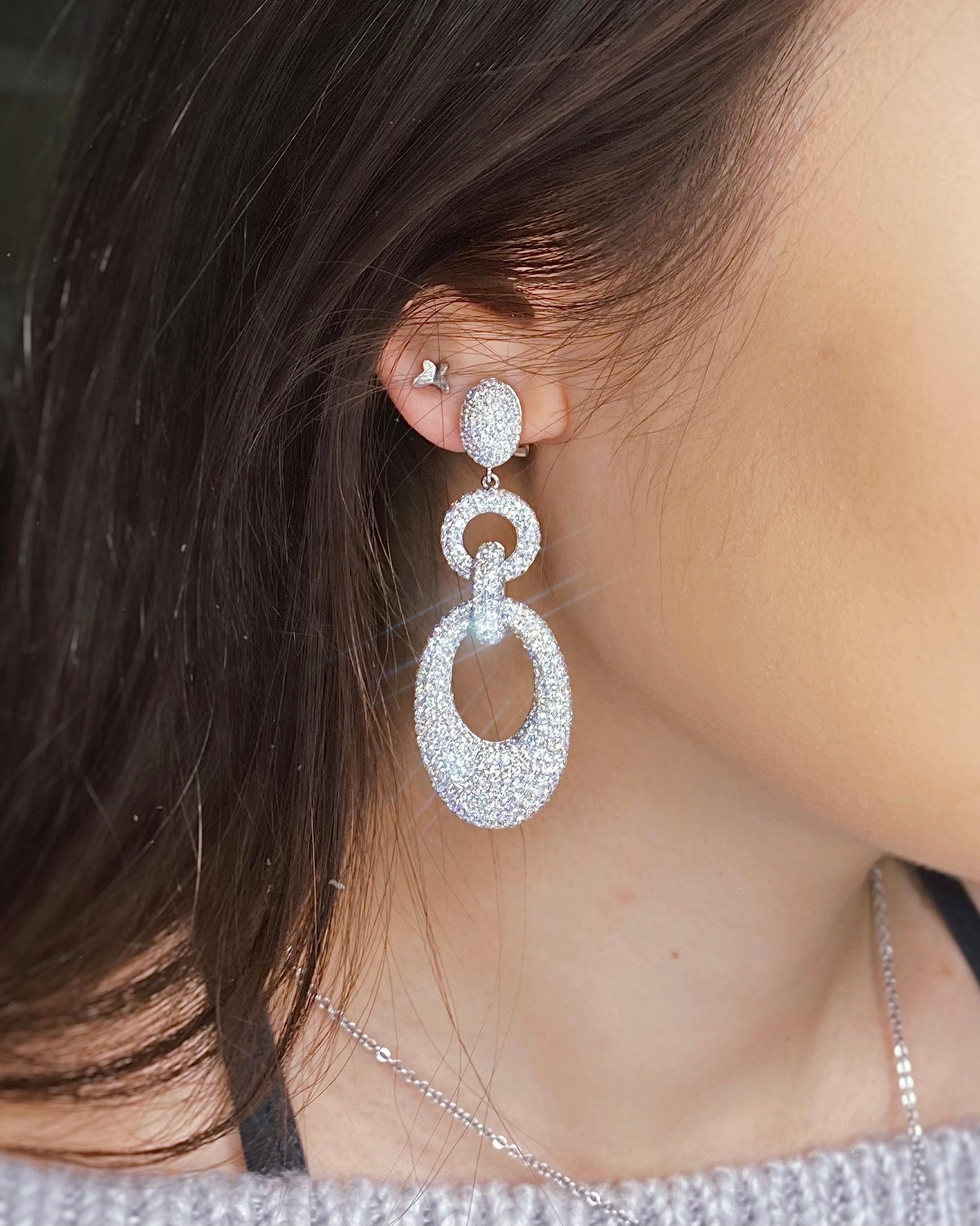 Total carat: 14CT
Metal: 18 K White Gold
Length : 52 mm
Stone Clarity: (F-G, VS2-SI1)

18k White gold 14CT Diamond earrings with micro pave diamonds EAR-179501
Total carat: 14CT
Metal: 18K White Gold
Length : 52 mm
Stone Clarity: (F-G, VS2-SI1)