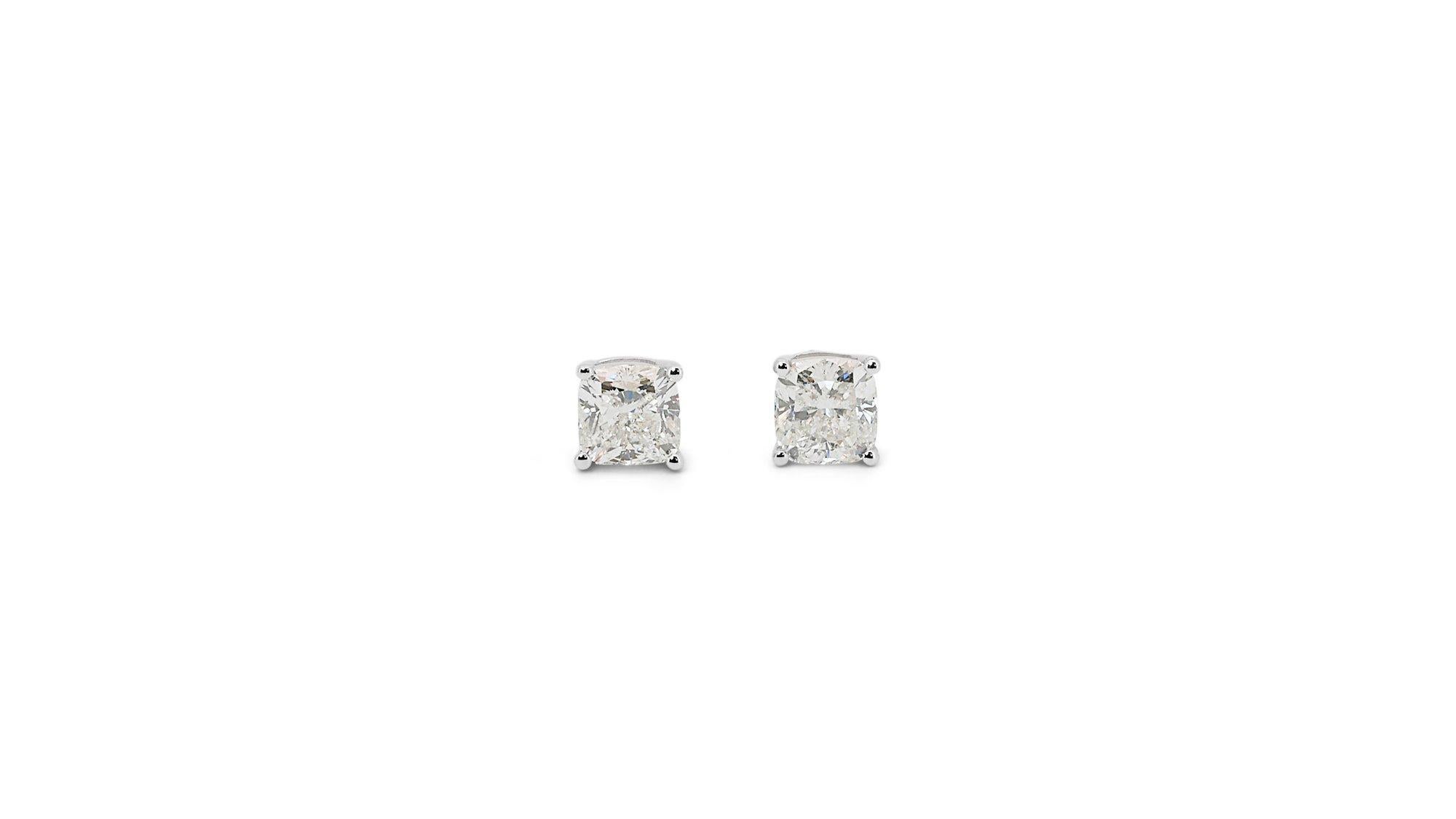 A beautiful pair of stud earrings with dazzling 2.01-carat cushion shape diamonds. The jewelry is made of 18K White Gold with a high-quality polish. It comes with an AIG certificate and a fancy jewelry box.

2 diamonds main stones total of 2.01