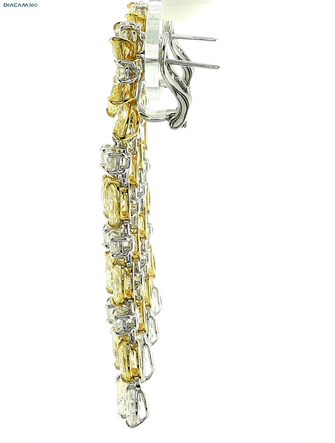 Earrings set in 18K Yellow Gold by Sophia D. The clip earrings feature a Yellow Diamond and Diamond that totals 22.10 carats. 

Measures approximately 3.0