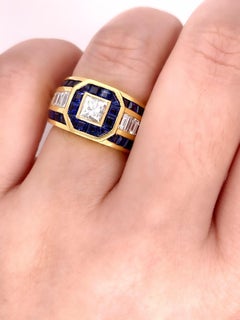 Sophia D. 0.64 Carat Diamond Center with Blue Sapphires Dome Ring in Yellow Gold