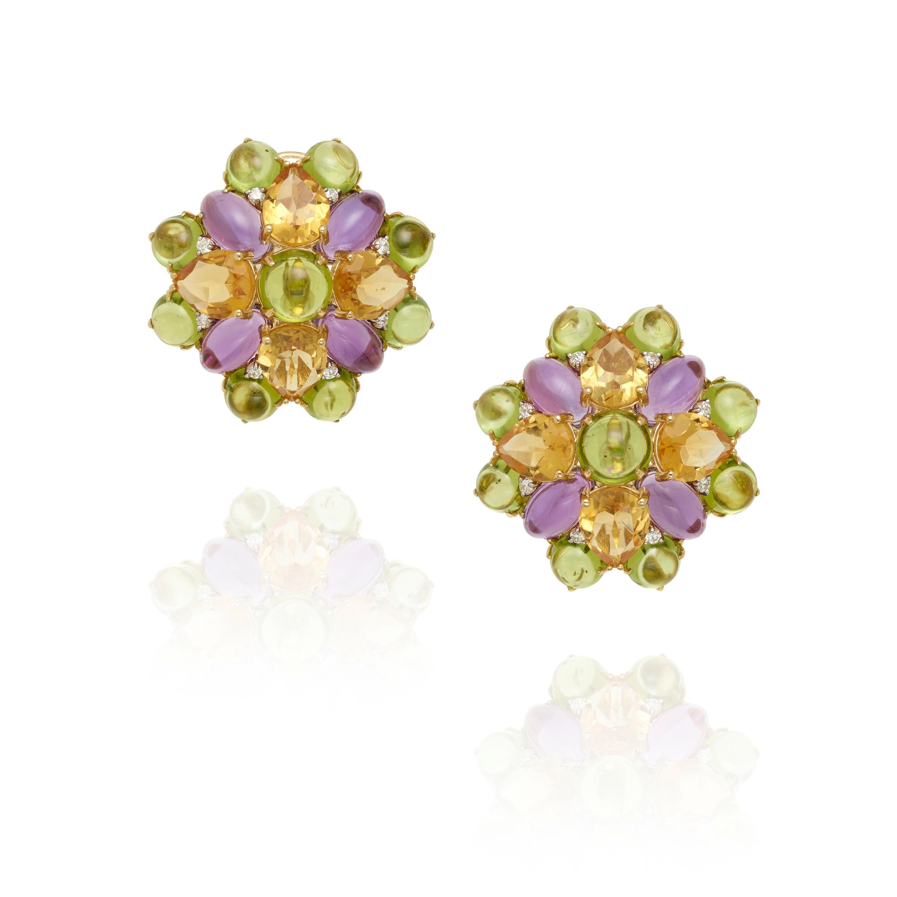 Unique Gem-Studded Round Earrings
Feature Round Peridot Cabochons, Oval Amethyst Cabochons, and Pear-Shaped Citrine
A Few Small Accent Diamonds
Diameter of Earrings = 1