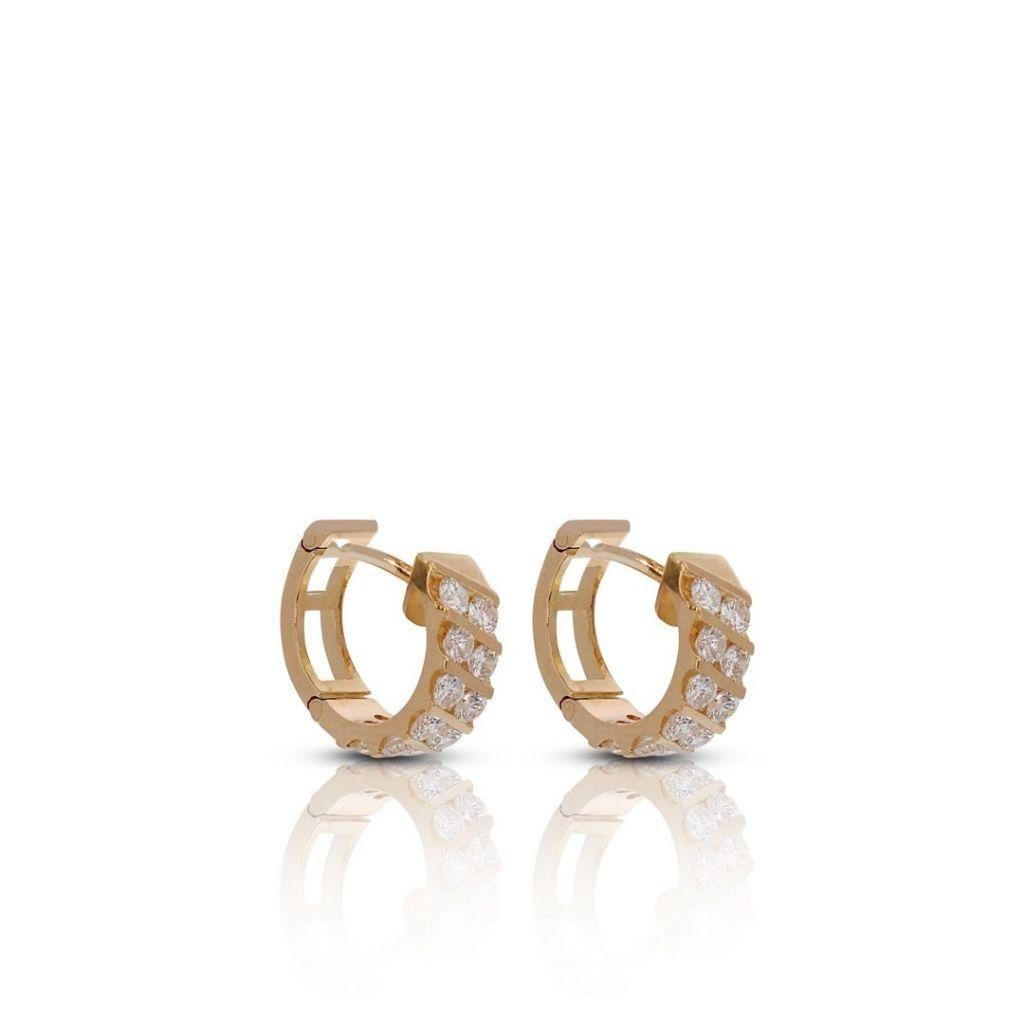 Crafted in luxurious 18K yellow gold, these elegant earrings feature 24 round brilliant diamonds, totaling 3.12 carats, with an H-I color grade that provides a near-colorless and luminous appearance. The SI1-SI2 clarity signifies slight inclusions,