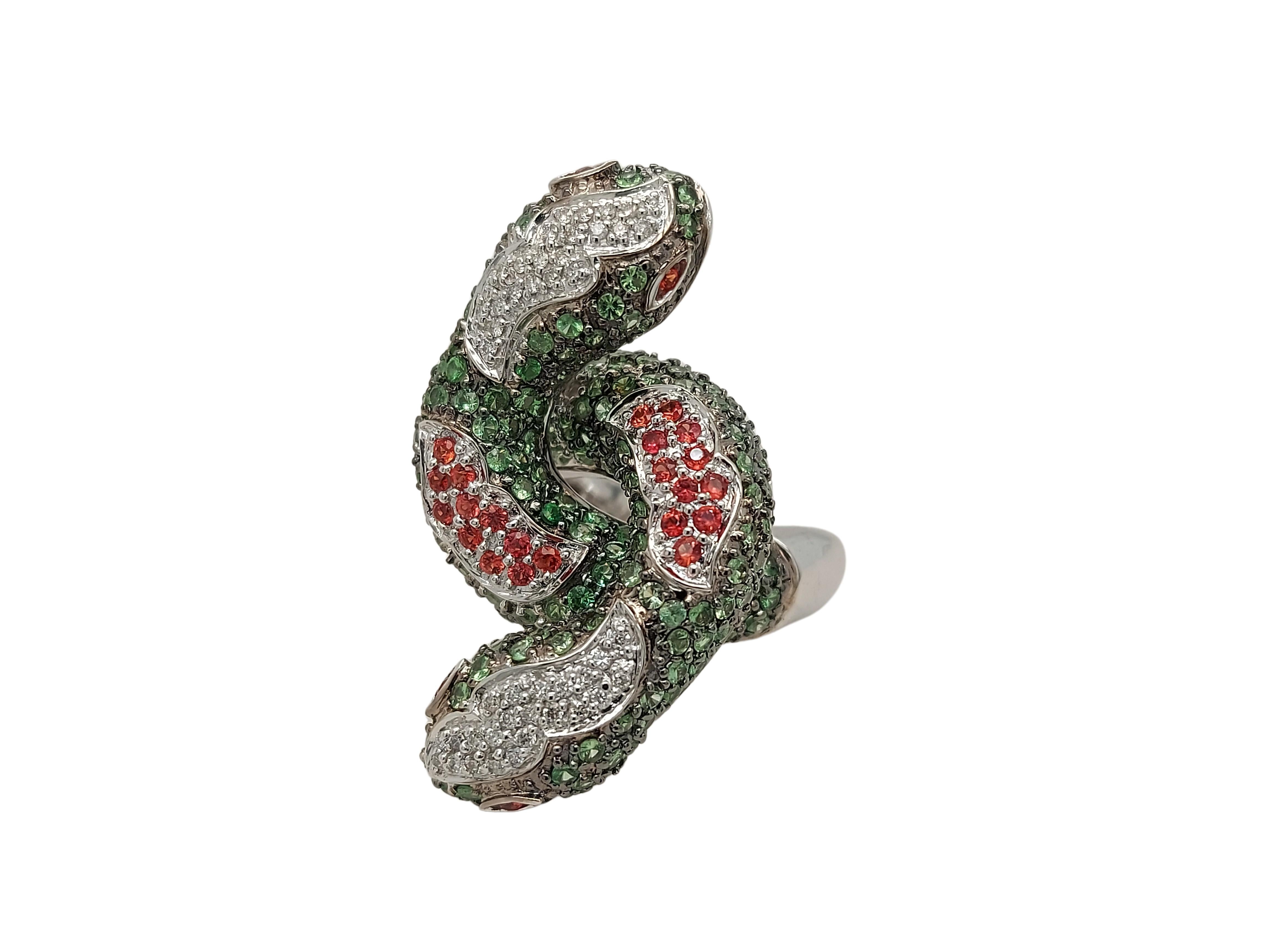 Gorgeous 18kt White Gold Double Snake ring Set with diamonds &  Precious Stones

Precious stones:
Diamonds: 50 diamonds 
Green : 200
Topaz: 26

Material: 18kt White Gold

Total weight: 21.6 gram / 0.760 oz / 13.9 dwt

Ring size: 57 EU / 8 US (can be