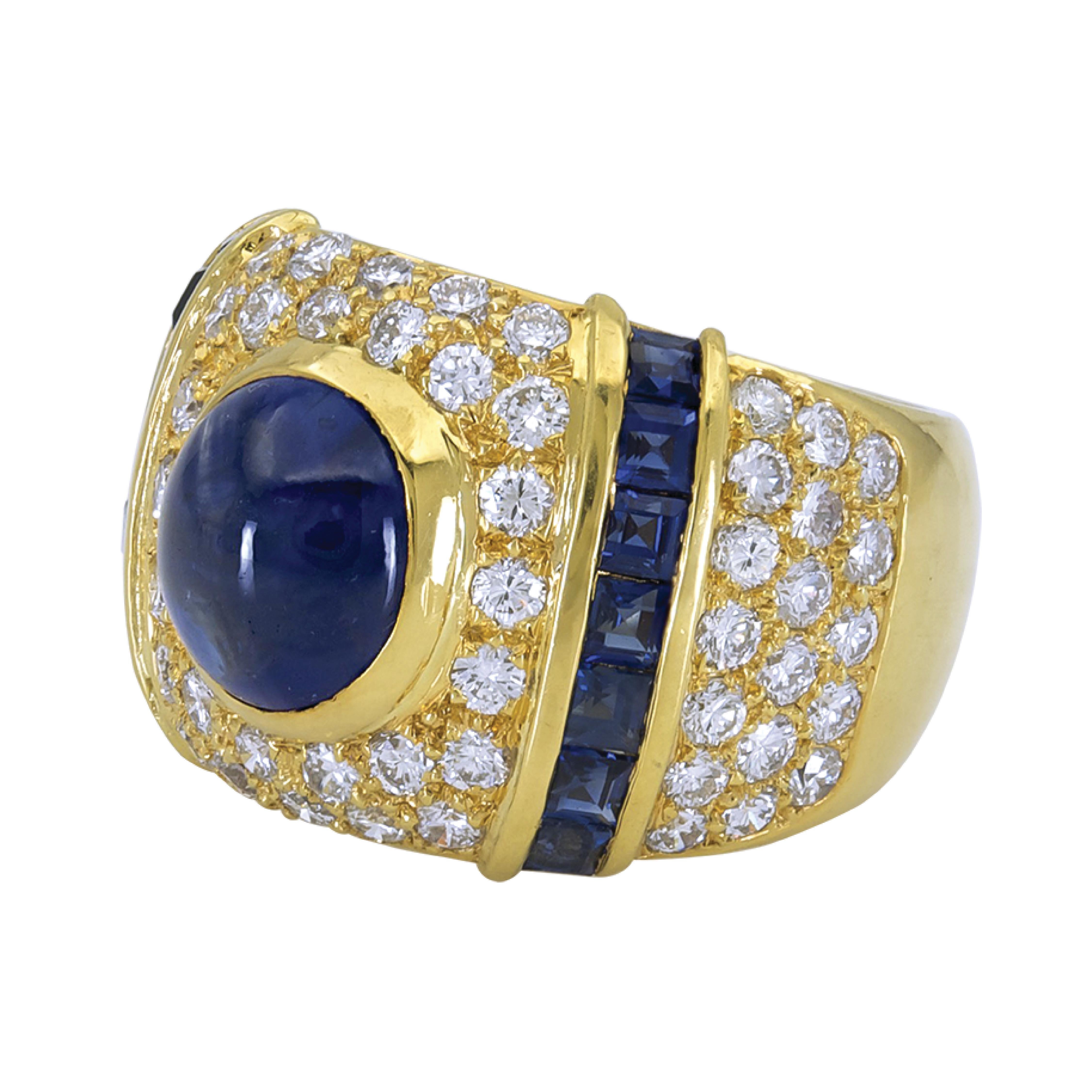 This dome ring features a center cabochon blue sapphire that weighs 5.67 carats and 1.88 carats of diamonds set in 18 karat yellow gold.

Sophia D by Joseph Dardashti LTD has been known worldwide for 35 years and are inspired by classic Art Deco