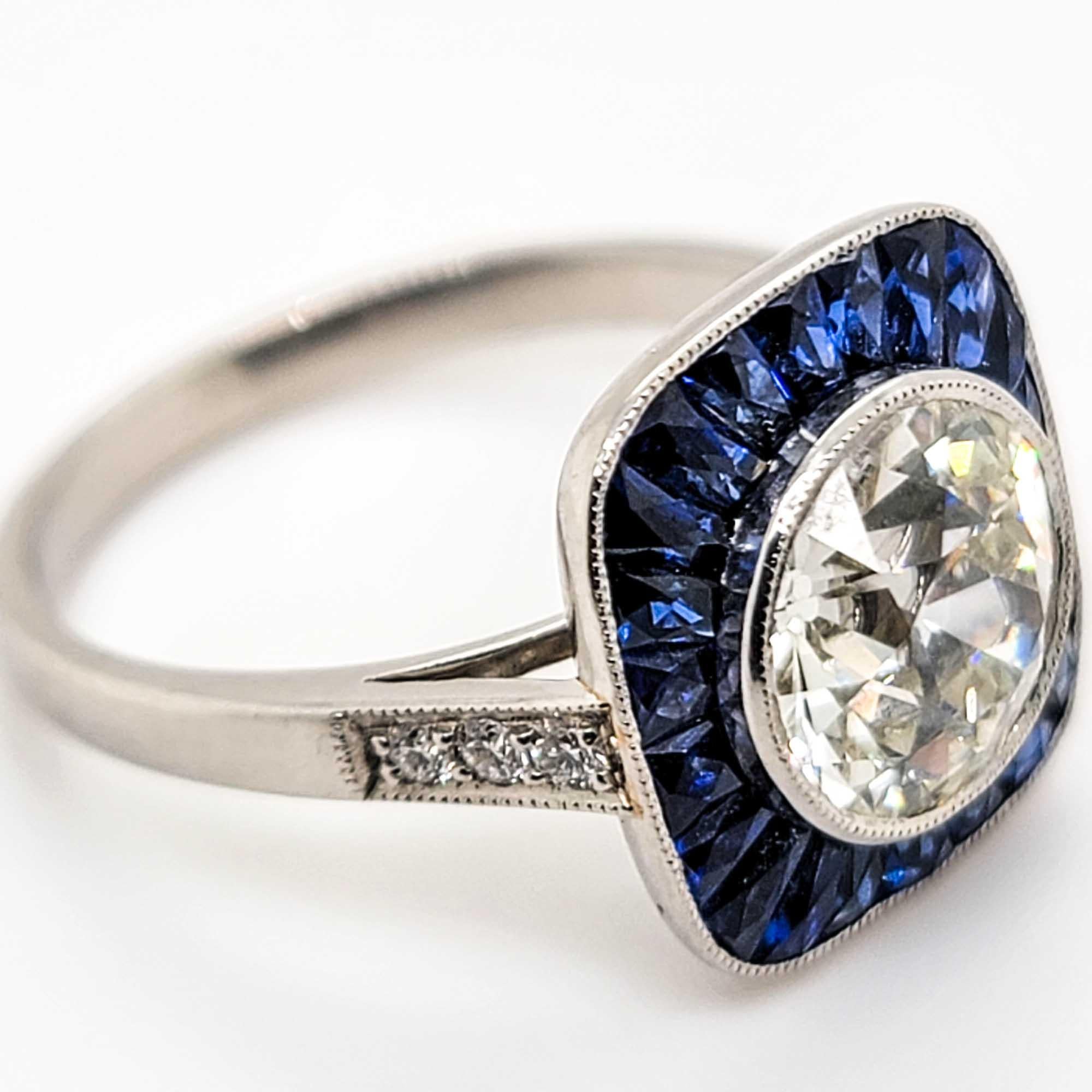 sapphire ring surrounded by diamonds