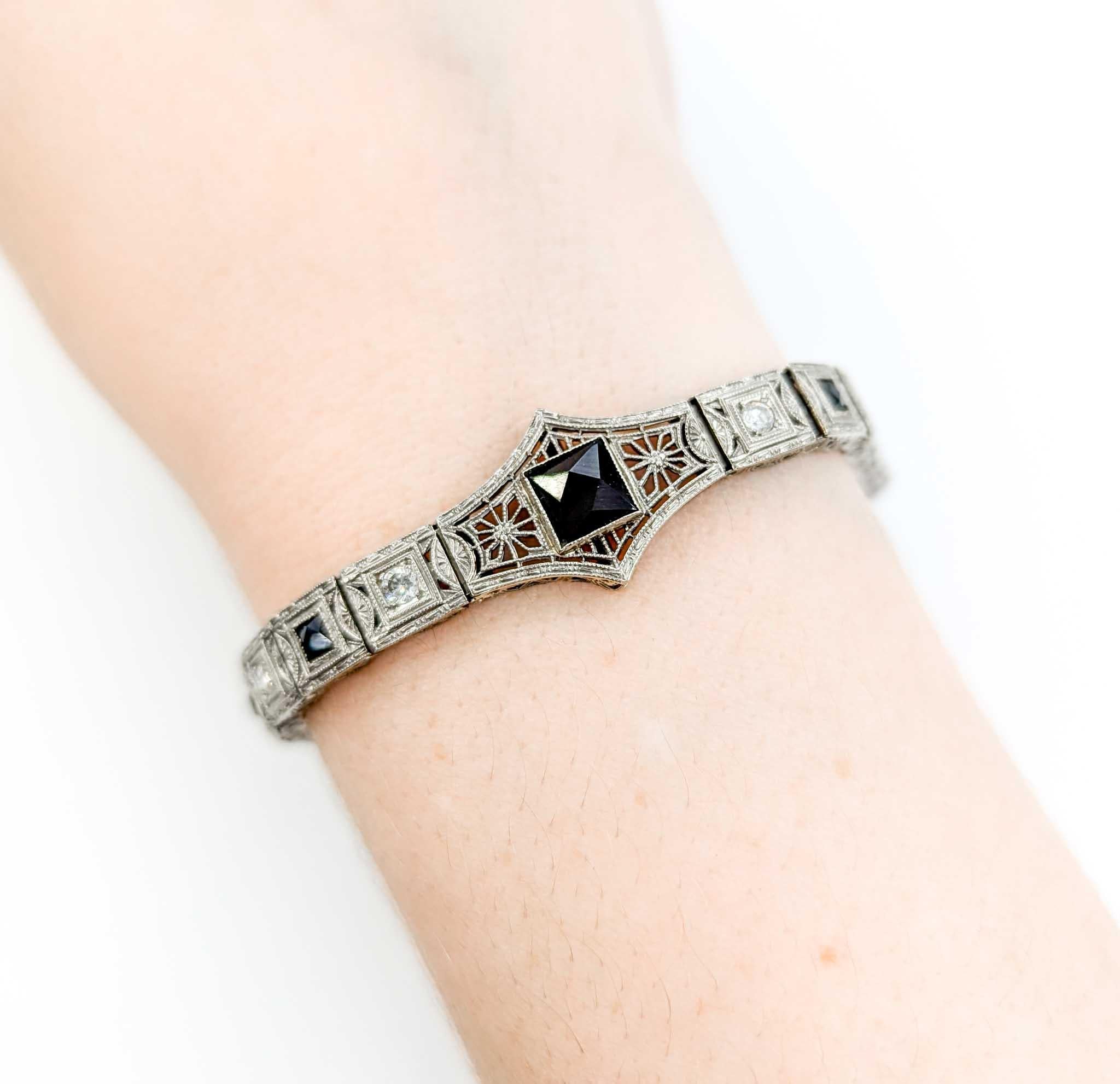 Gorgeous 1920s Art Deco Onyx & Diamond Filigree Bracelet in White Gold

Introducing this stunning art deco onyx & diamond bracelet crafted in platinum and 14k white gold. The bracelet features .32ctw diamonds paired with elegant onyx accents,