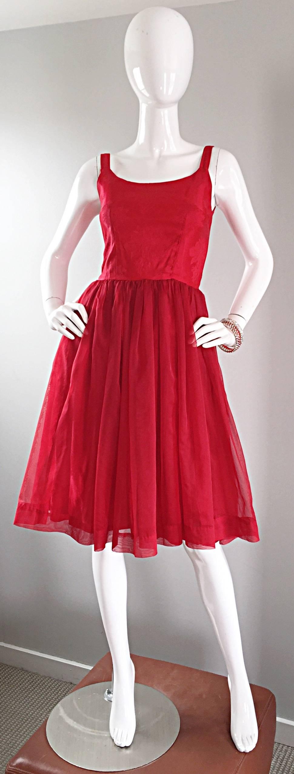 Stunning 1950s vintage lipstick red DEMI COUTURE silk brocade dress! Floral brocade throughout with a wonderful chiffon overlay skirt. Mostly hand sewn. Full metal zipper up the back. Very well constructed with a heavy eye to detail. Perfect from