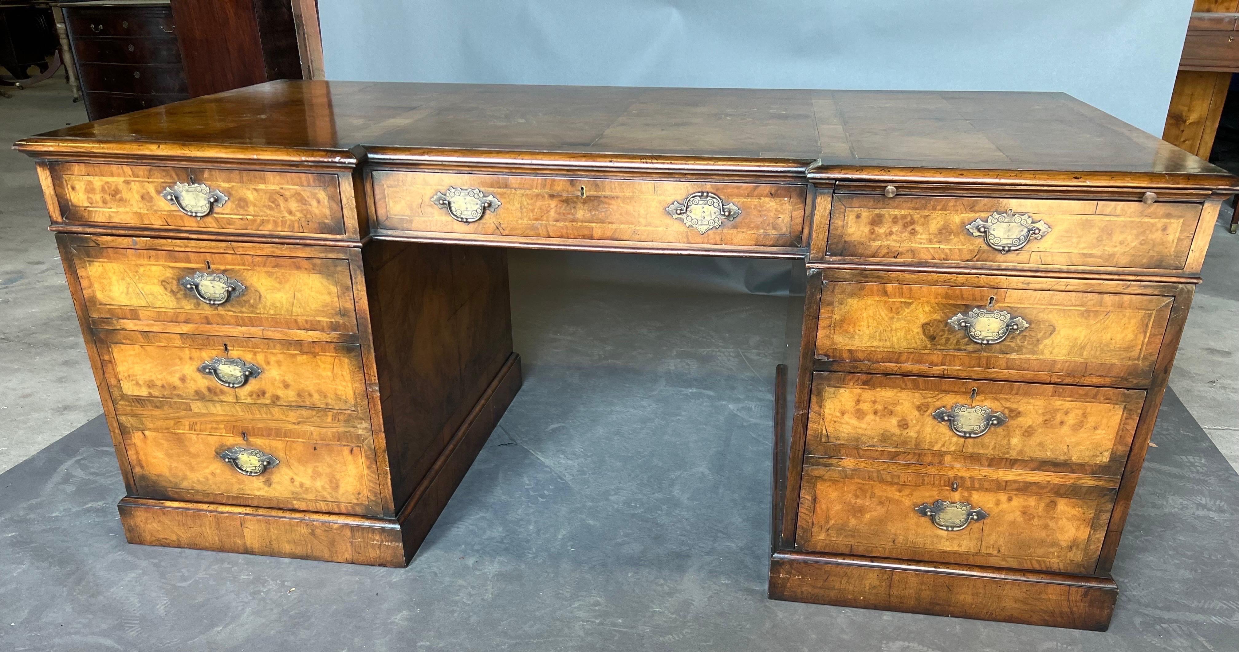 Gorgeous 19th century English burl walnut three part desk. Finished all around with faux drawers on the opposite side and pull out writing slide that would work very well for a laptop computer.  Very handsome piece. 