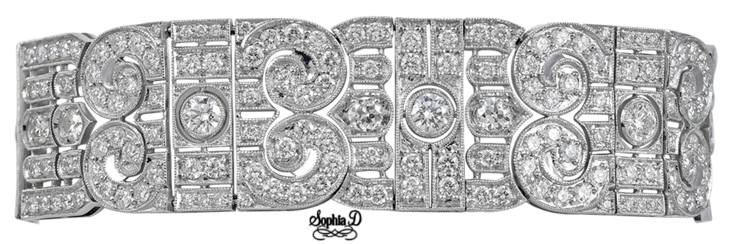 This stunning bracelet designed by Sophia D is with 6 center round diamonds with the total carat weight of 3.74 carats surrounded with brilliant round diamonds with carat weight of 17.63. 

The length of the bracelet is 7.5