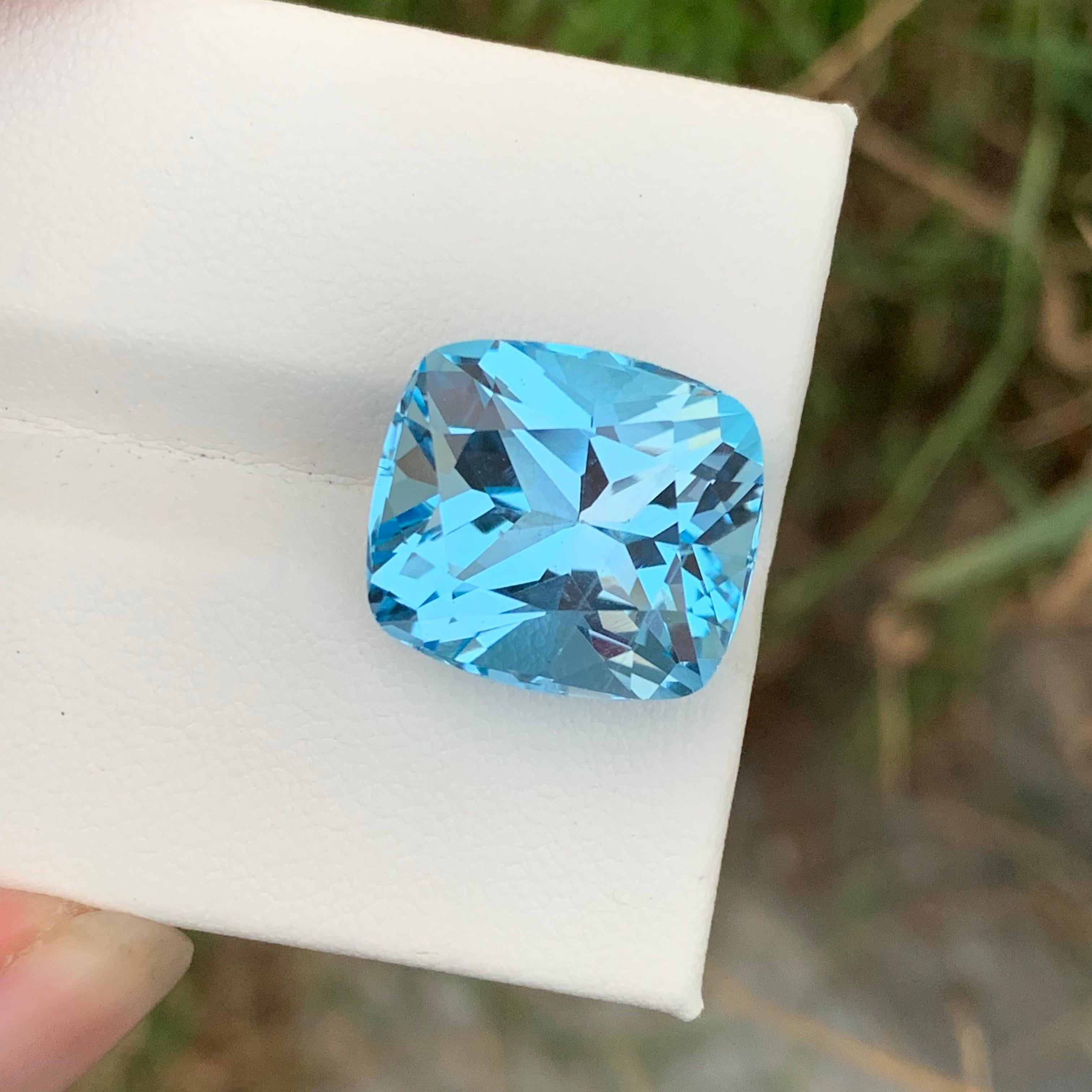 Faceted Sky Blue Topaz 
Weight: 22.25 Carats 
Dimension: 16.4x14.7x11.1 Mm
Origin: Brazil
Color: Blue
Shape: Cushion 
Certificate: On Customer Demand 
.
Sky blue topaz, a serene and captivating gemstone, is known for its soothing blue hue that