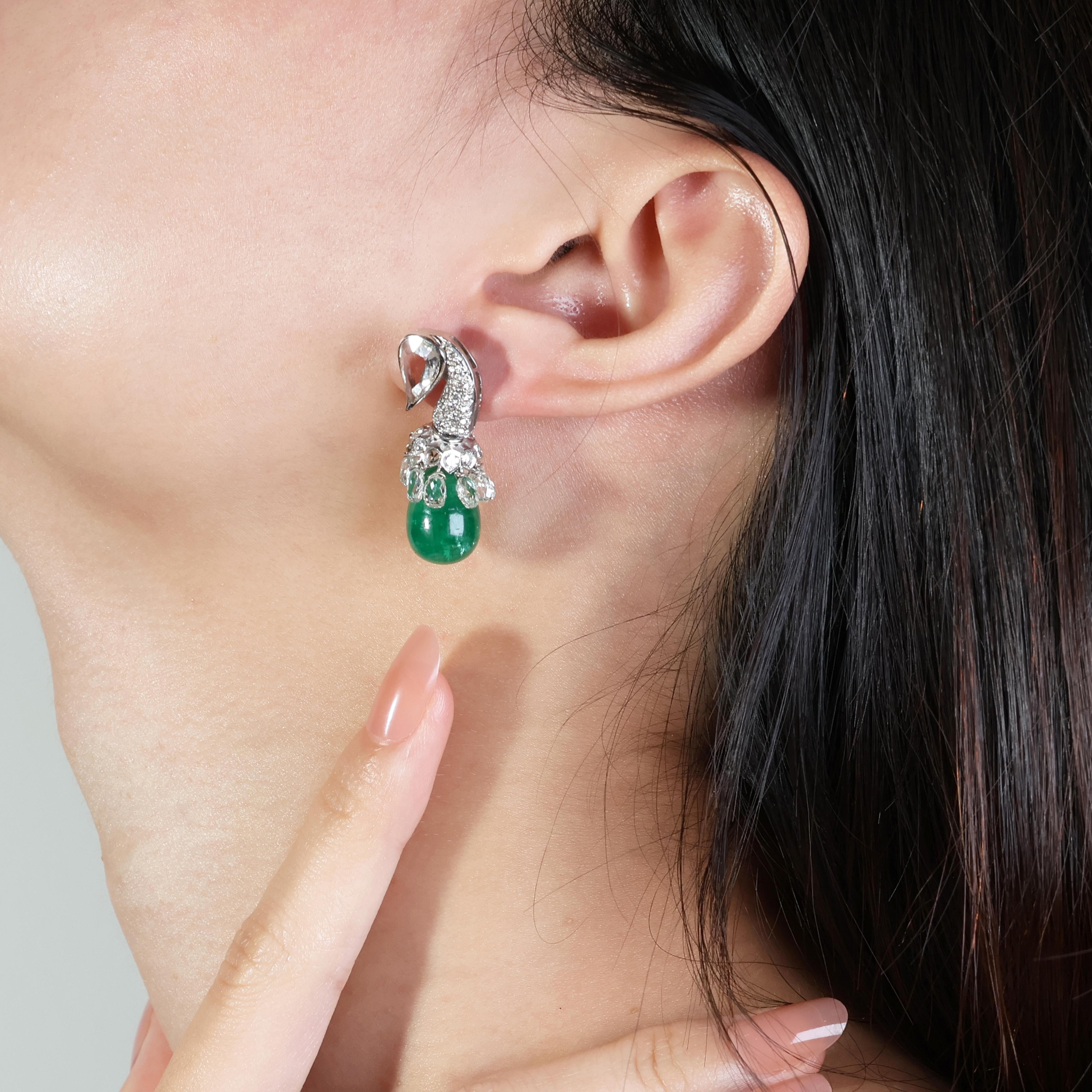 Immerse yourself in the brilliance of these captivating 18k white gold earrings, where two captivating emeralds, are surrounded by a dazzling symphony of diamonds.

Own a piece of jewelry that transcends trends and embodies timeless elegance. These