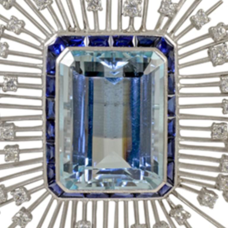 This brooch is designed with aquamarine stone in the center with the total carat weight of 35.03 accented with sapphire with the carat weight of 3.70 and diamonds with the total carat weight of 3.55. 

Sophia D by Joseph Dardashti LTD has been known