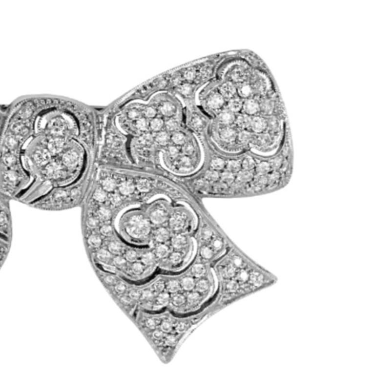 This elegant brooch in a bow tie design, crafted with all brilliant diamonds with a total carat weight of 4.16. 

Sophia D by Joseph Dardashti LTD has been known worldwide for 35 years and are inspired by classic Art Deco design that merges with