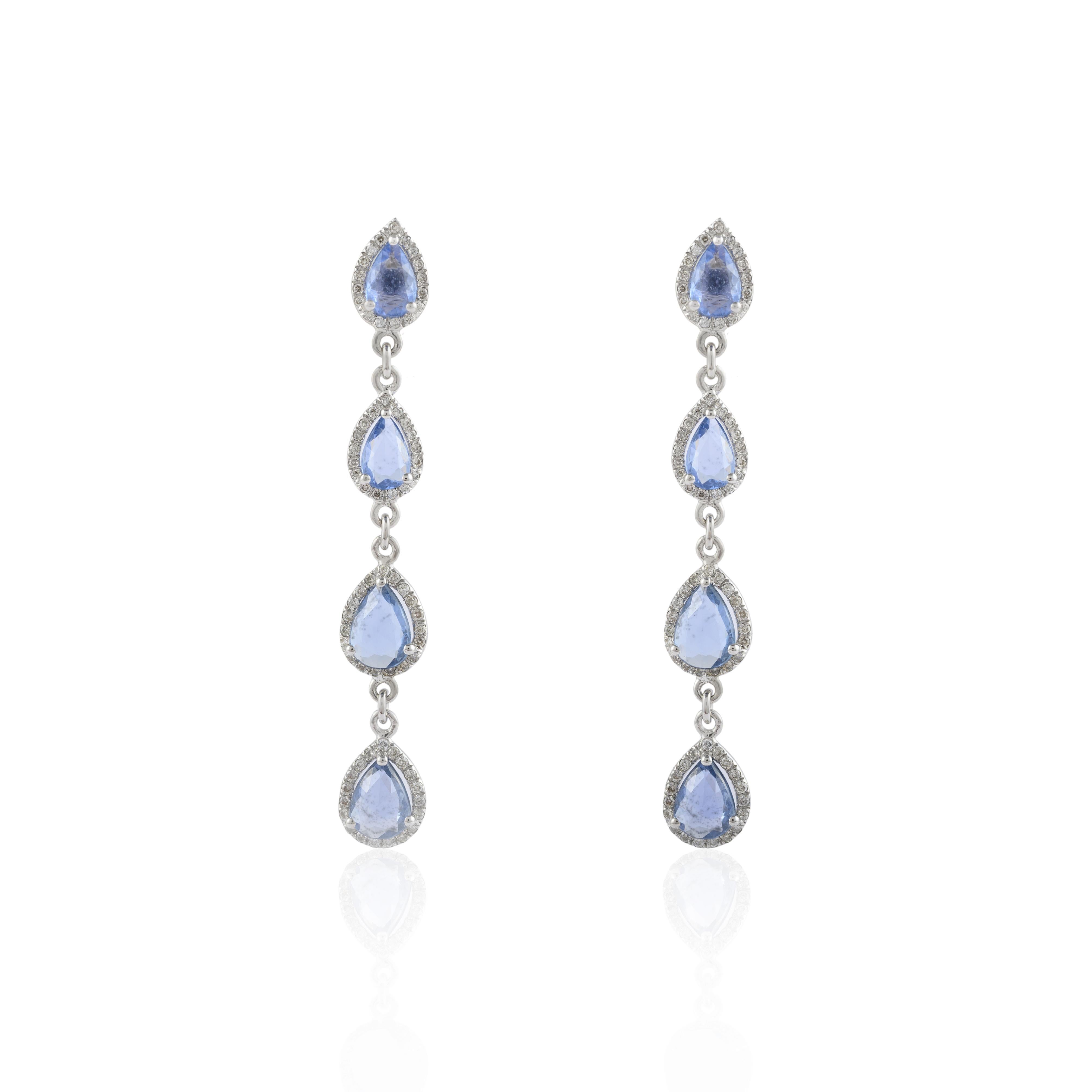 Diamond Blue Sapphire Long Dangle Earrings in 14K Gold to make a statement with your look. These earrings create a sparkling, luxurious look featuring pear cut gemstone.
Sapphire stimulates concentration and reduces stress. 
Designed with 4 pear cut