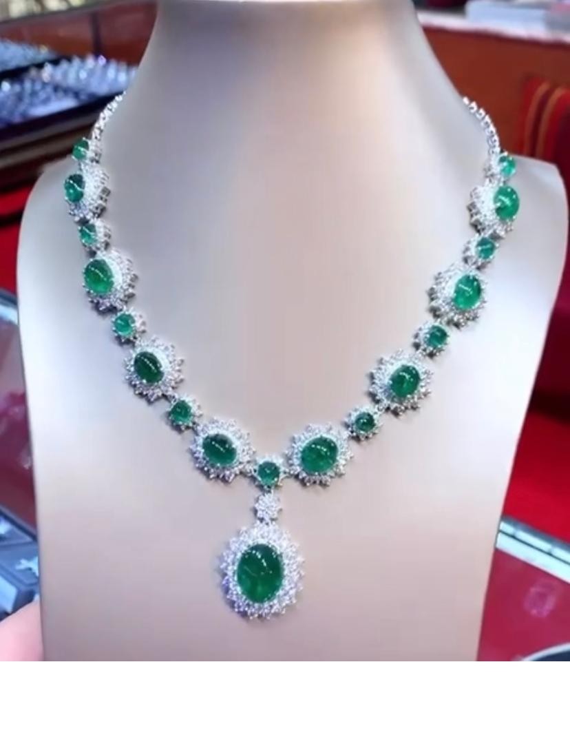 An exquisite design , very glamour and refined, by Italian designer , a very piece of art.
Necklace come in 18k gold , with 18 pieces of natural Zambia emeralds, oval cabochon cut, fine quality , of 46,80 total carats.  Pendant emerald is of 12,56