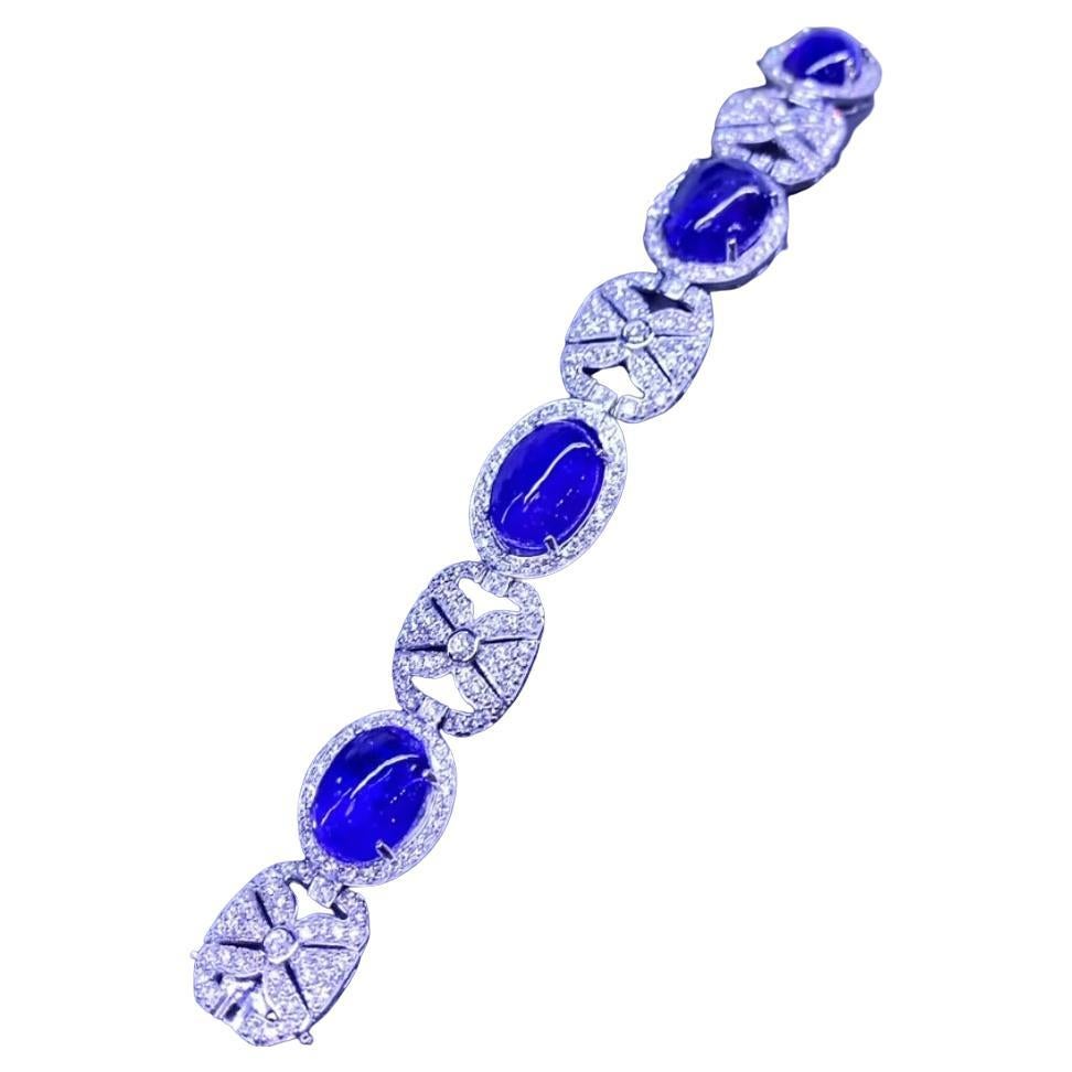 Gorgeous 62, 90 Carats of Tanzanites and diamonds on bracelet in gold 