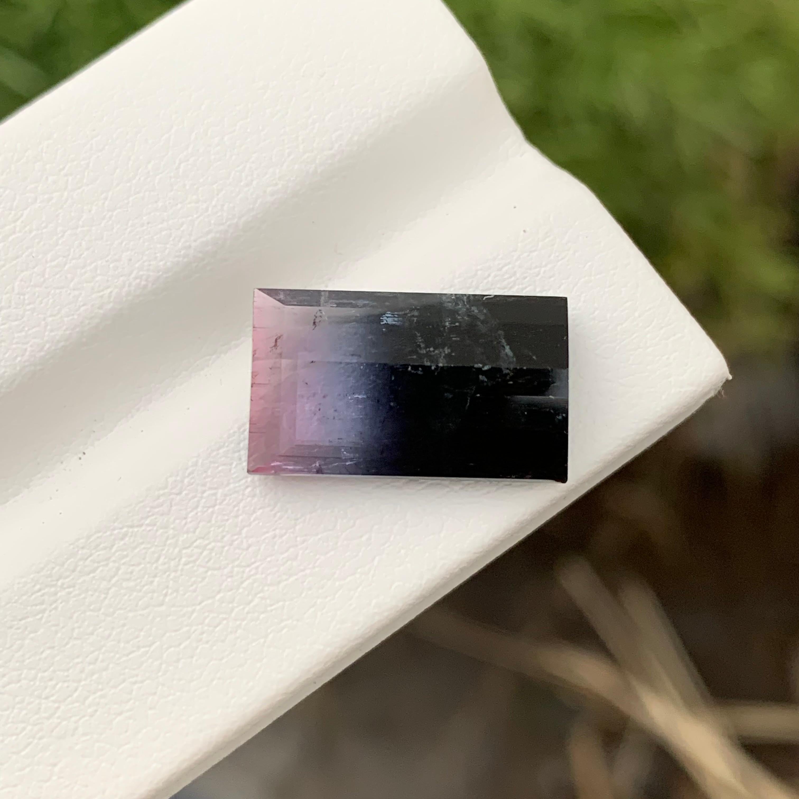 Loose Bicolor Tourmaline 
Weight: 8.60 Carats 
Dimension: 16.2x9.7x5.4 Mm
Origin: Skardu Pakistan 
Shape: Baguette
Treatment: Non
Color: Black & Pink
Black Pink bicolor tourmaline is a mesmerizing gemstone renowned for its striking combination of