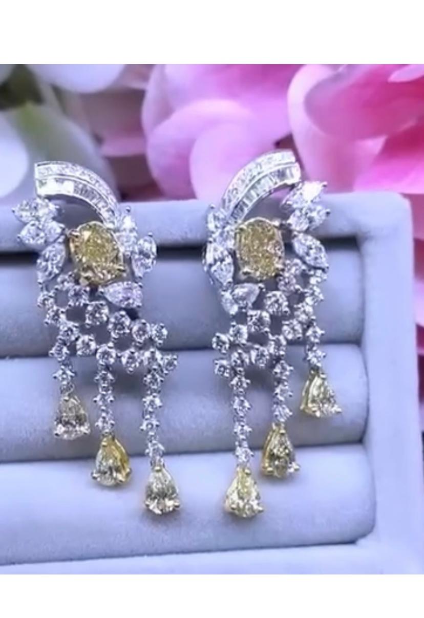 An exquisite and original design, from Italian designer. This earrings are the expression of the beauty and art . Piece of high jewelry.
Earrings come in 18k gold with two pieces of GiA certified natural fancy yellow brownish diamonds, in oval cut,