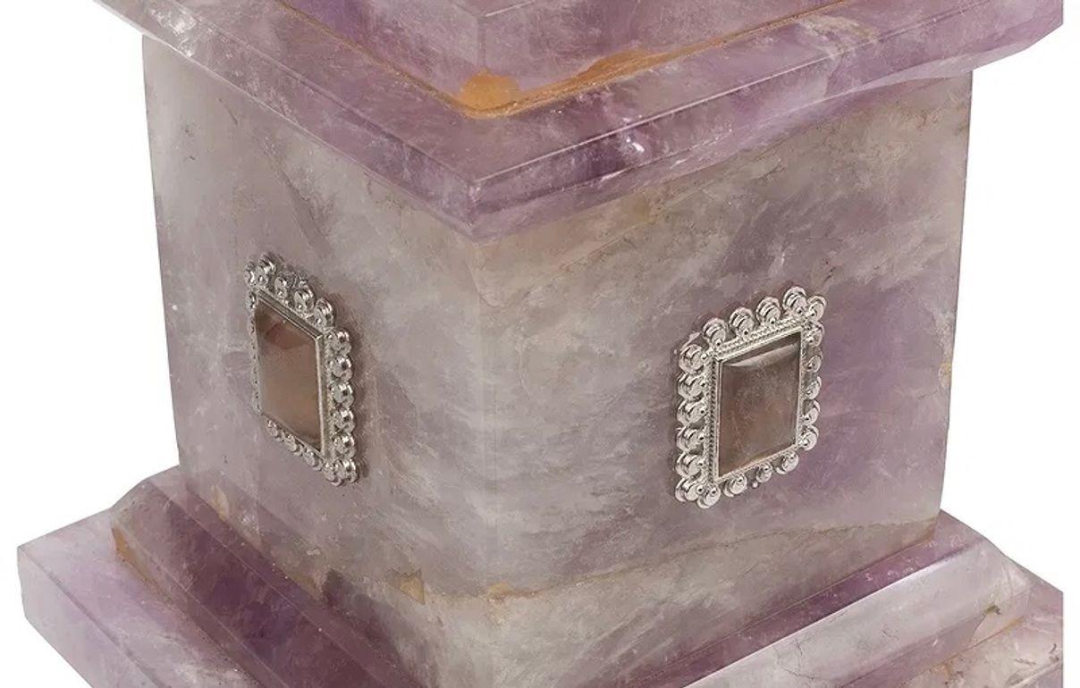 Gorgeous and rare pair of French amethyst Neo-classical urns.  A fine addition to any home! 15h x 4.5d x 4.5w