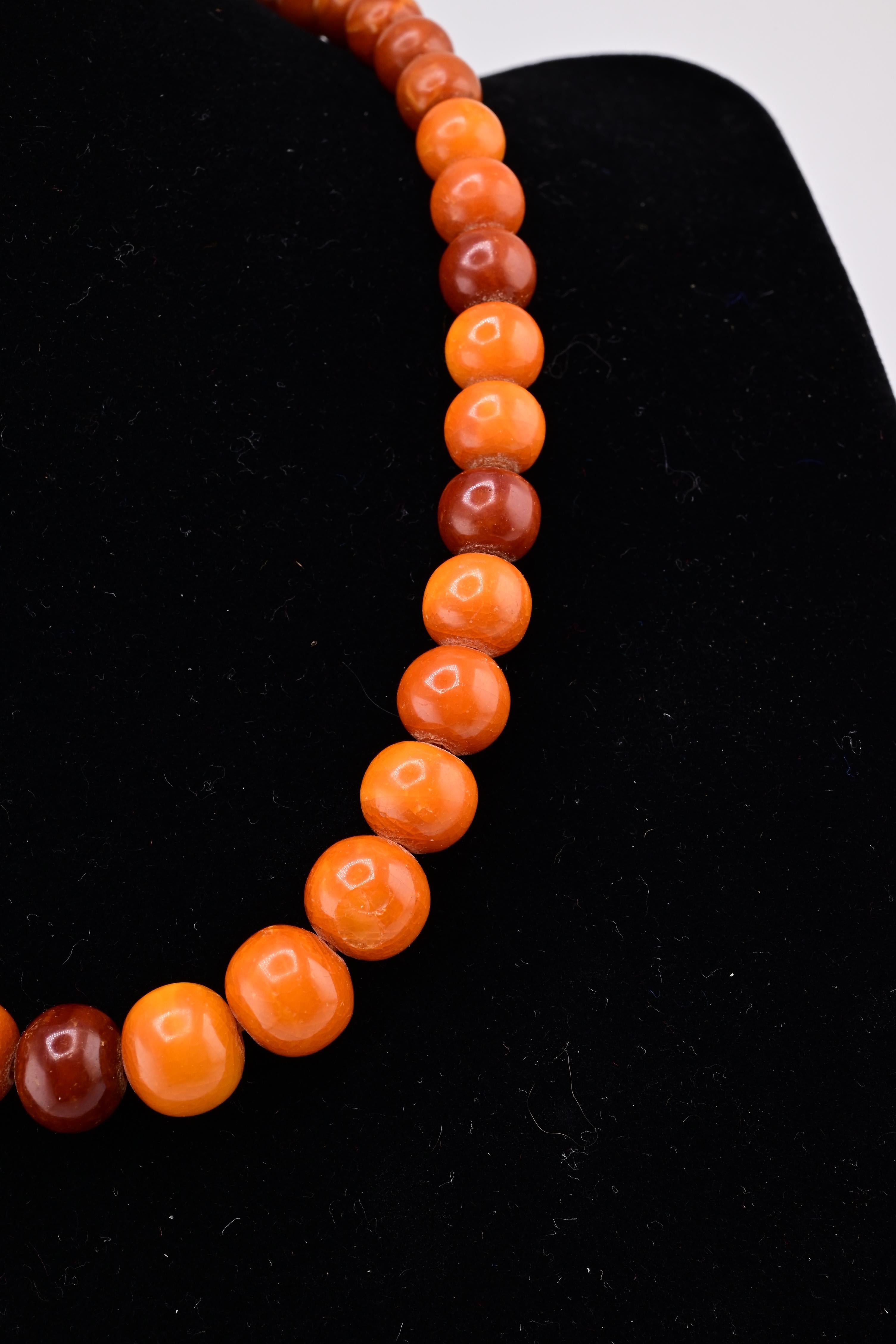 Gorgeous antique butterscotch amber necklace, total weight is 15.17 grams. The are some very minor chips, nicks to be expected. Its a very cute and lovely necklace. The age is around 1900-1920s it has a deep rich marble color. The marbling and shape
