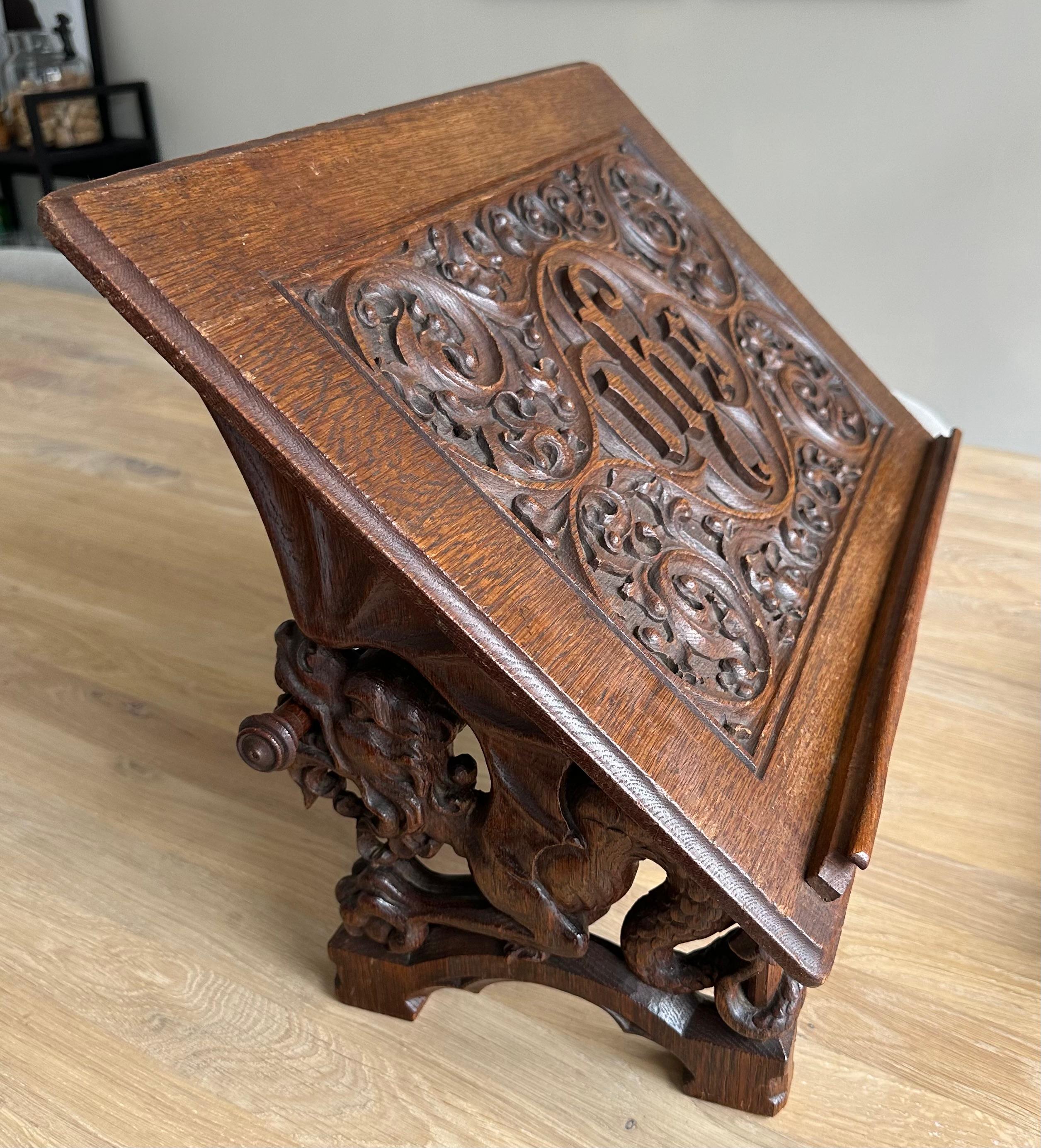 Unique, wonderfully sculptural and meaningful Gothic church bible stand.

This relatively large, hand carved antique Gothic Revival bible stand is another one of our recent rare finds. All handcrafted out of solid oak only, this church stand