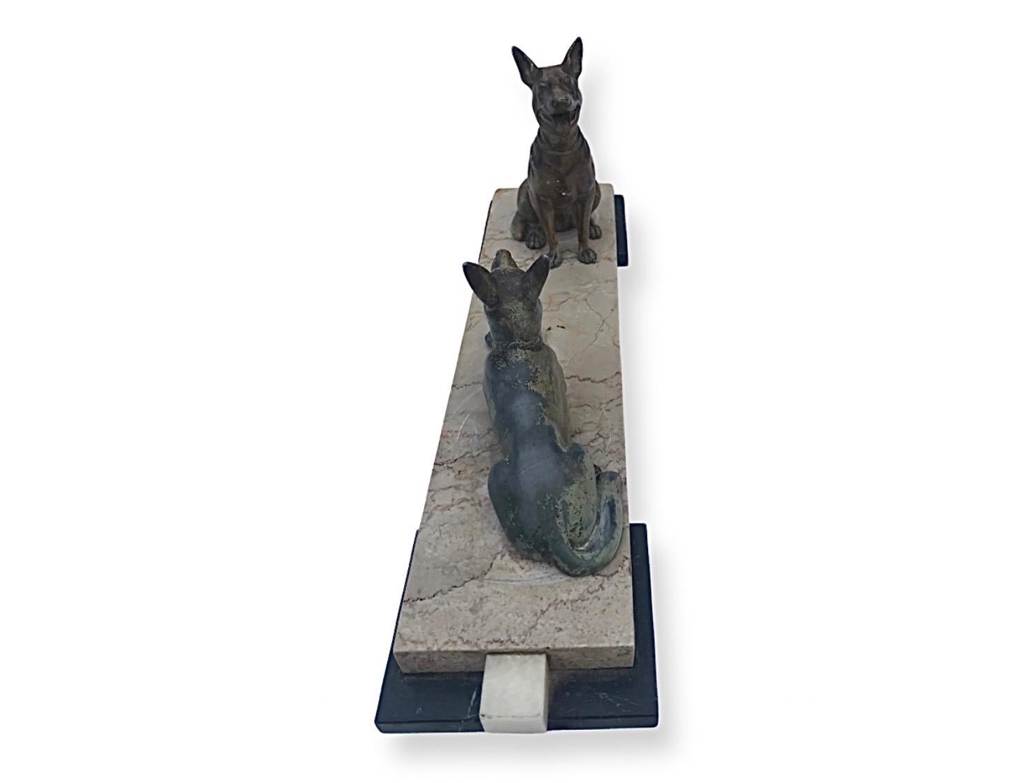 A wonderful Art Deco original decorative pair of cold painted Alsatians. Lovely details on both dogs, one seated and one laying down. These are in excellent original condition with no losses just a little wear to the finish on the Spelter. The